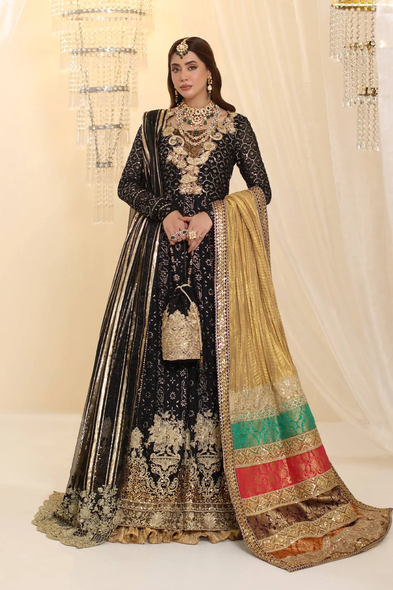 Model wearing Musferah Saad Enchantment dress in black and gold from the Ethereal Dream Formals collection, perfect for Pakistani wedding clothes online in the UK.