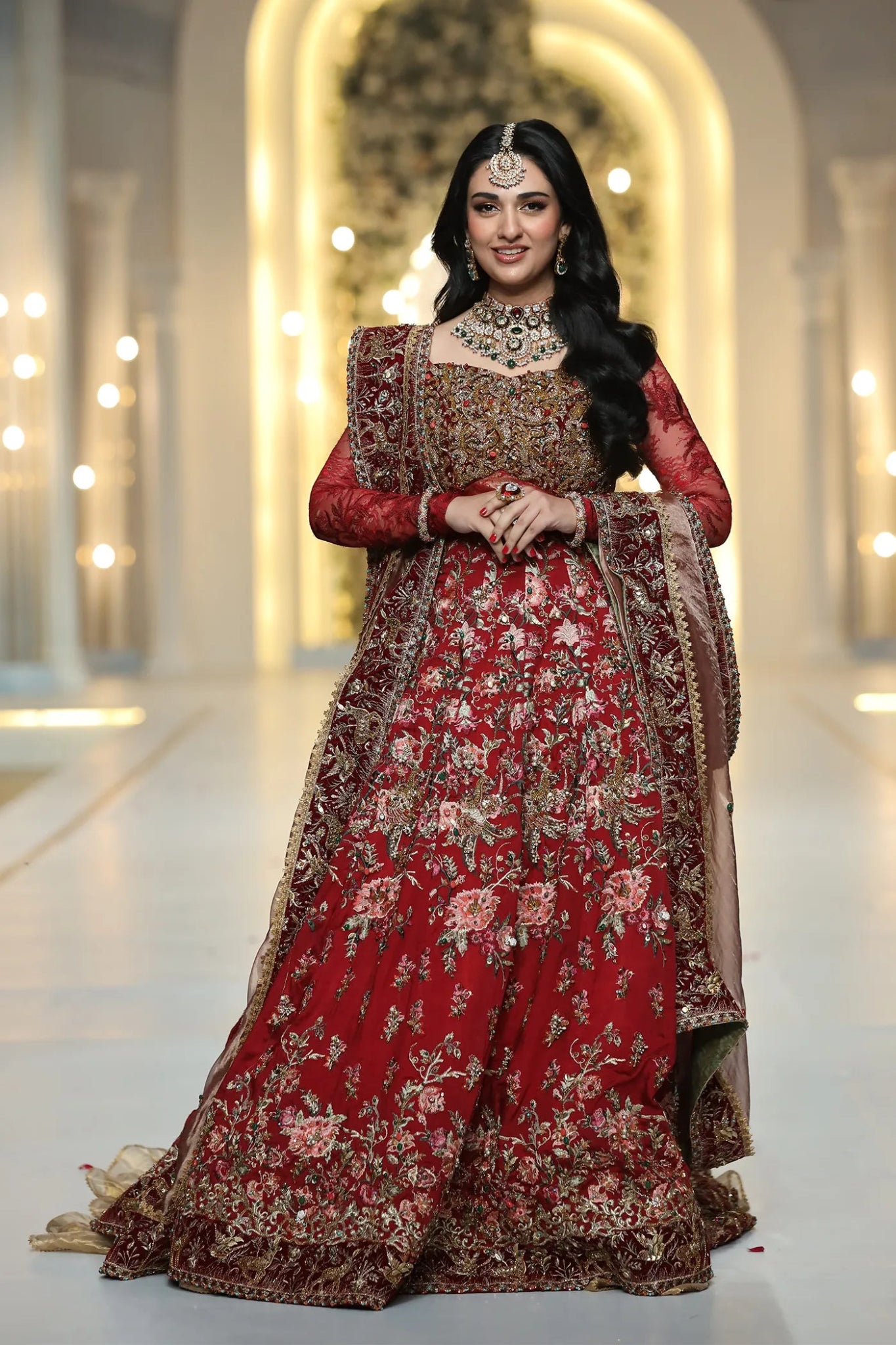 Model wearing a red ROYAL GODDESS dress from Musferah Saad's Luminous Love '24 collection, showcasing Pakistani clothes online in the UK.