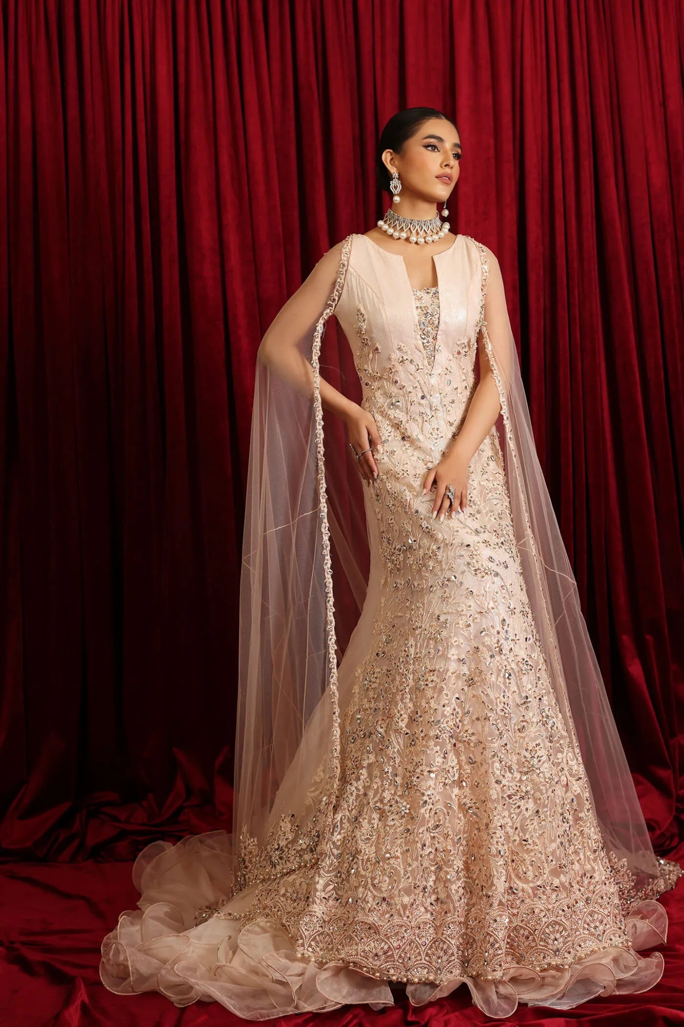 Model wearing a soft pink STARLIT QUEEN dress from Musferah Saad's Luminous Love '24 collection, showcasing Pakistani clothes online in the UK.