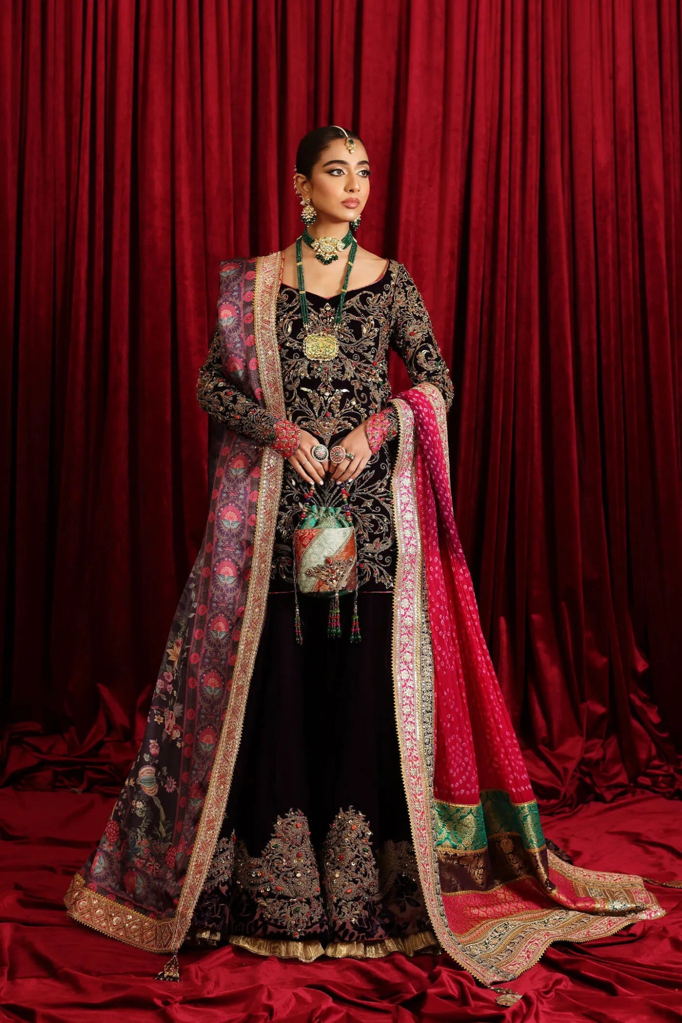 Model in Musferah Saad Velvet Symphony, opulent Pakistani bridal attire in UK.