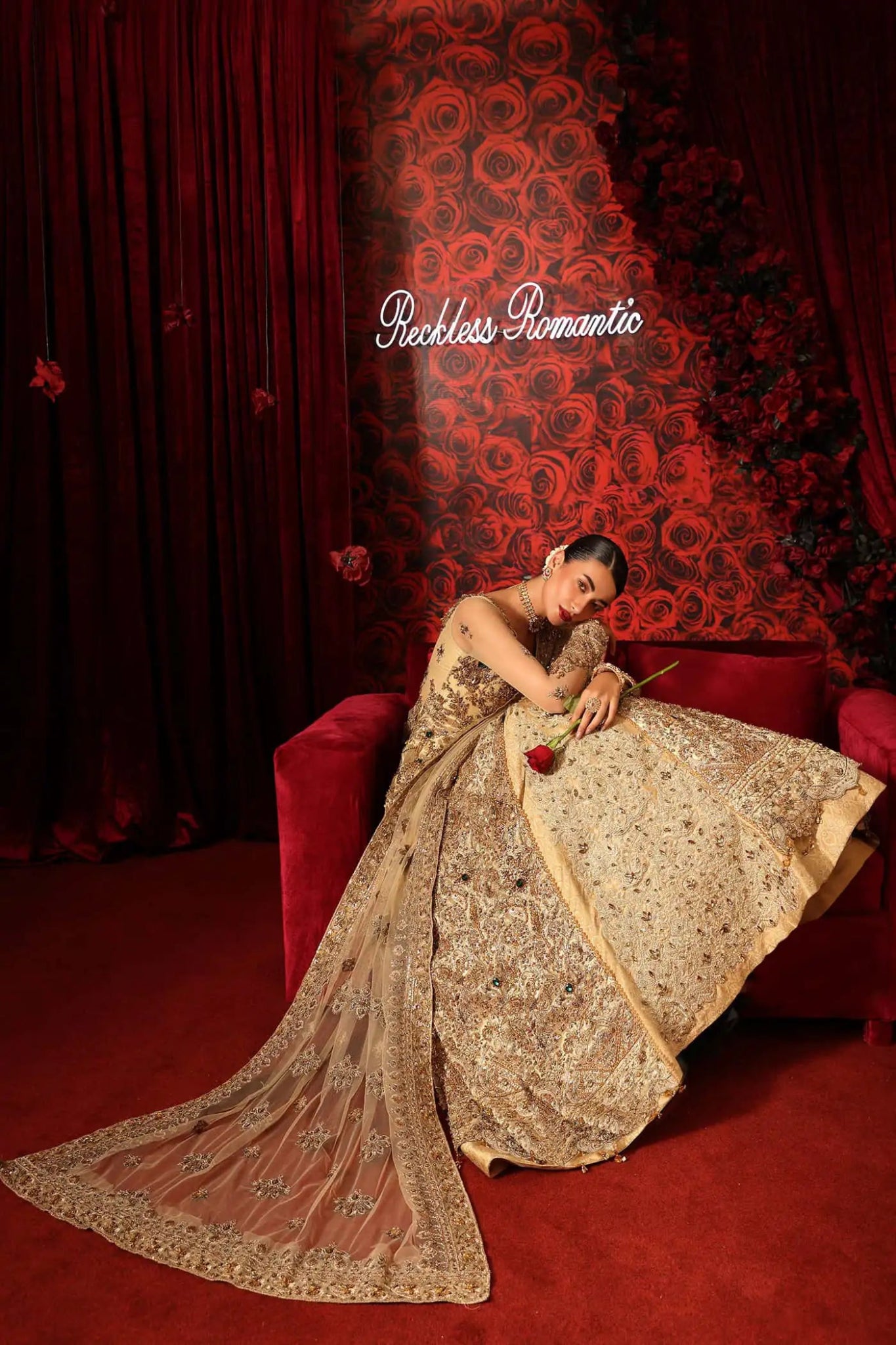 Model wearing Radiant Romance from Musferah Saad's Reckless Romantic collection in a stunning red hue. Pakistani clothes online in UK at Signature Labels.
