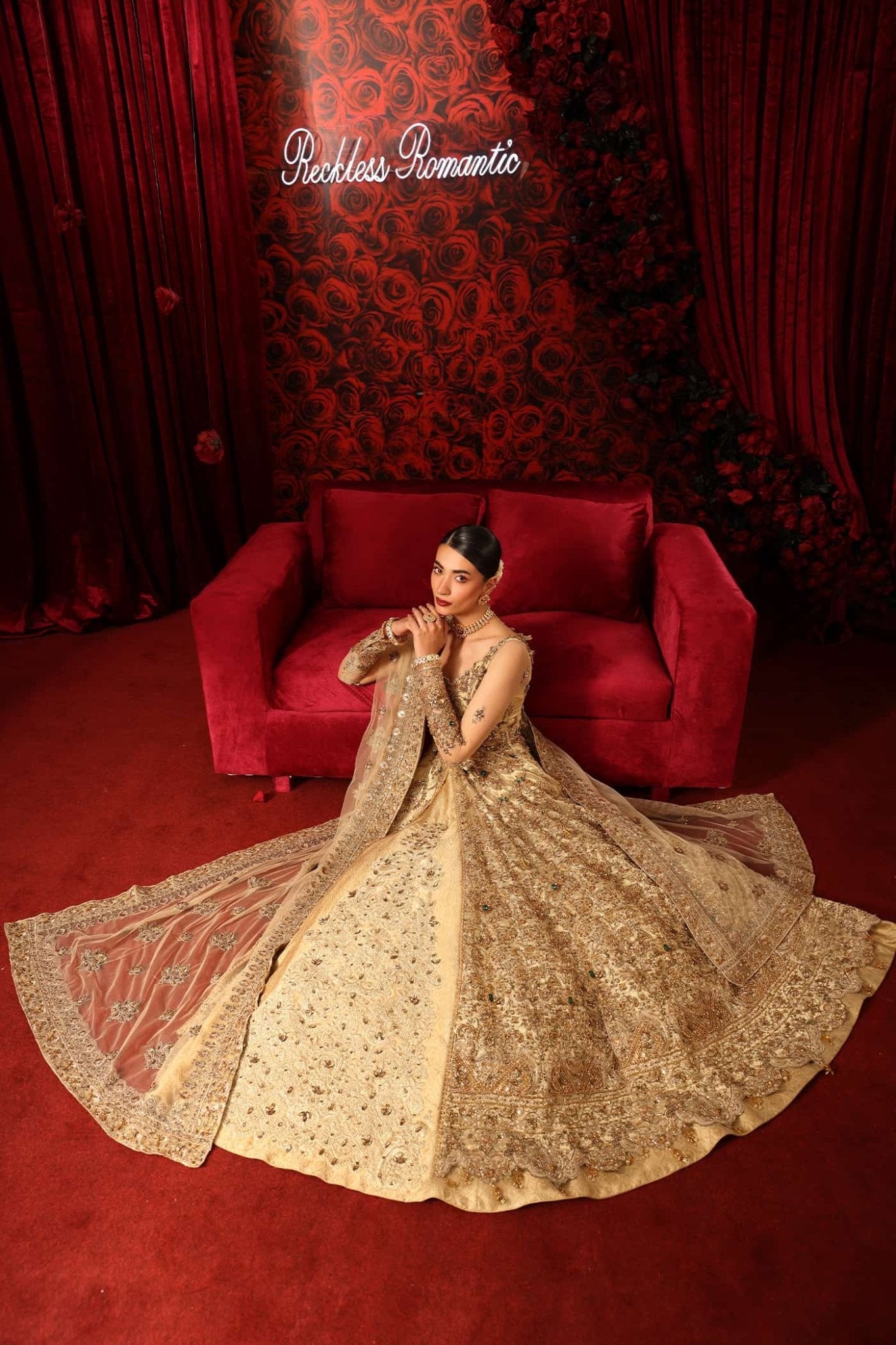Model wearing Radiant Romance from Musferah Saad's Reckless Romantic collection in a stunning red hue. Pakistani clothes online in UK at Signature Labels.