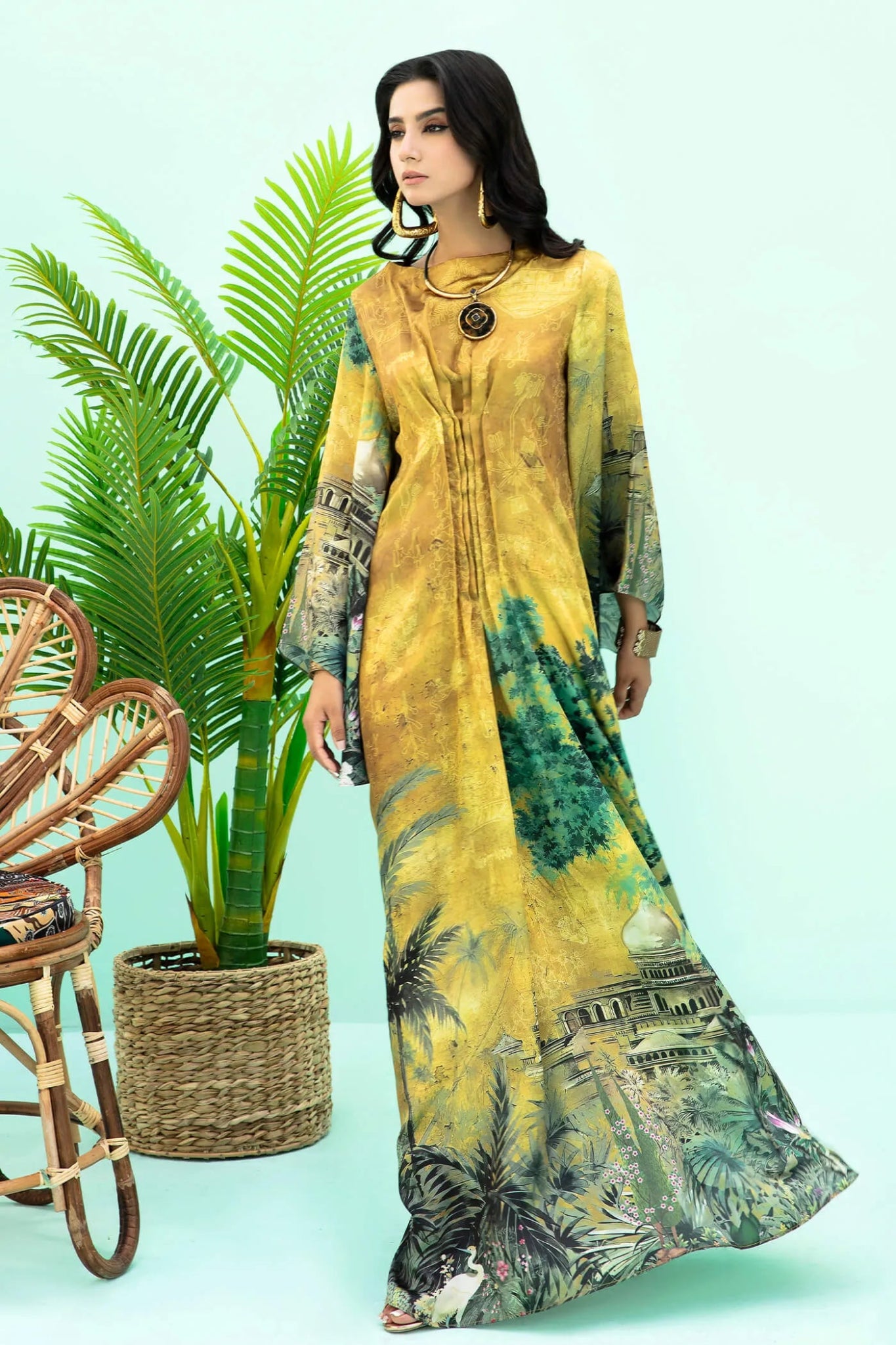 Model wearing mustard and green Aurelia dress from Musferah Saad's Resort collection '24, showcasing Pakistani clothes online in the UK.