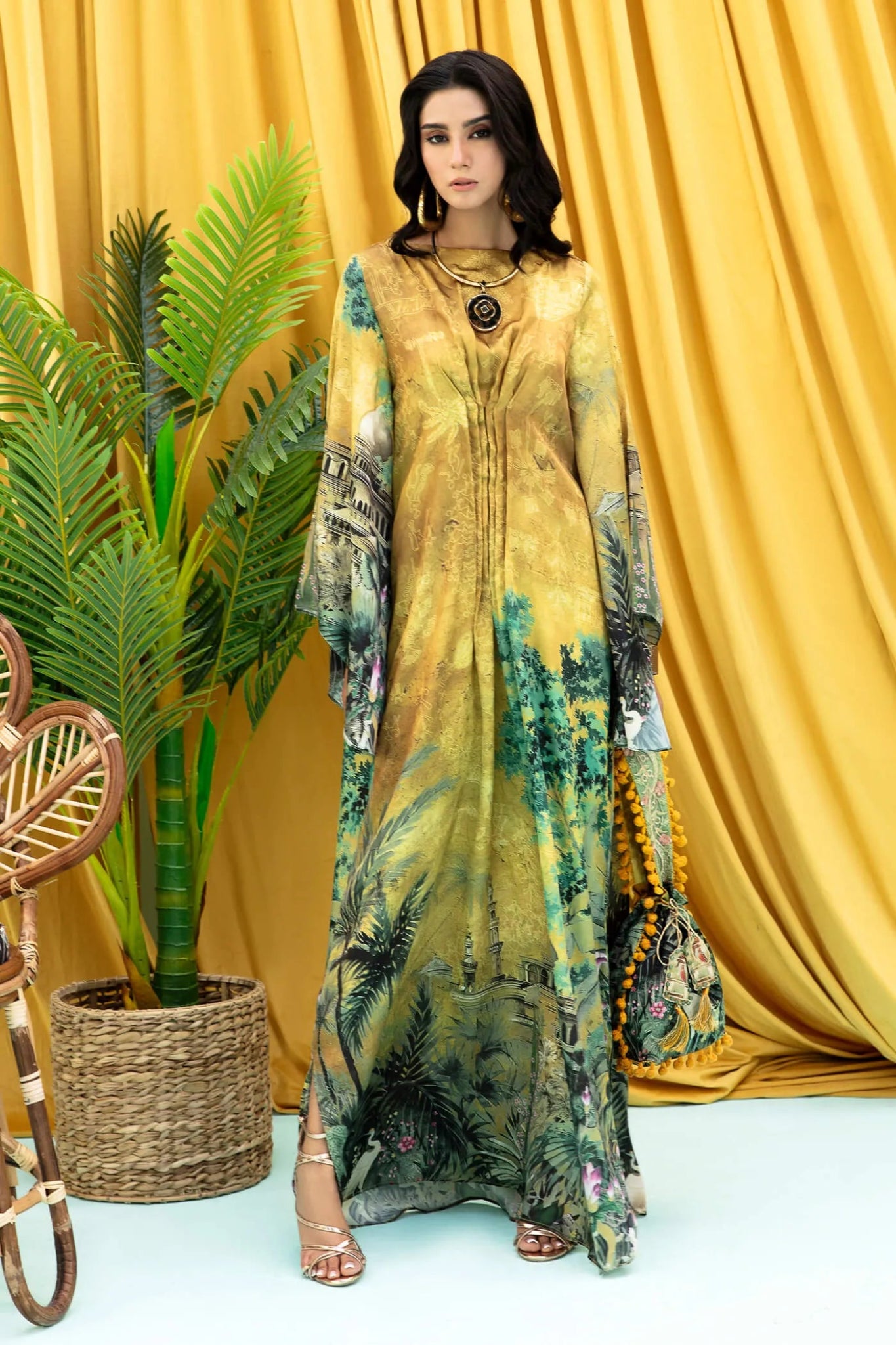 Model wearing mustard and green Aurelia dress from Musferah Saad's Resort collection '24, showcasing Pakistani clothes online in the UK.