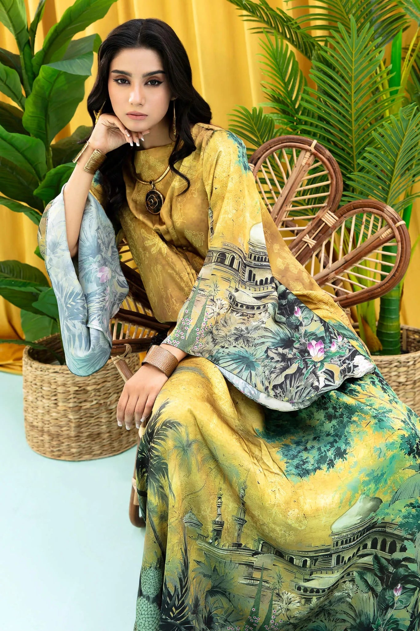 Model wearing mustard and green Aurelia dress from Musferah Saad's Resort collection '24, showcasing Pakistani clothes online in the UK.