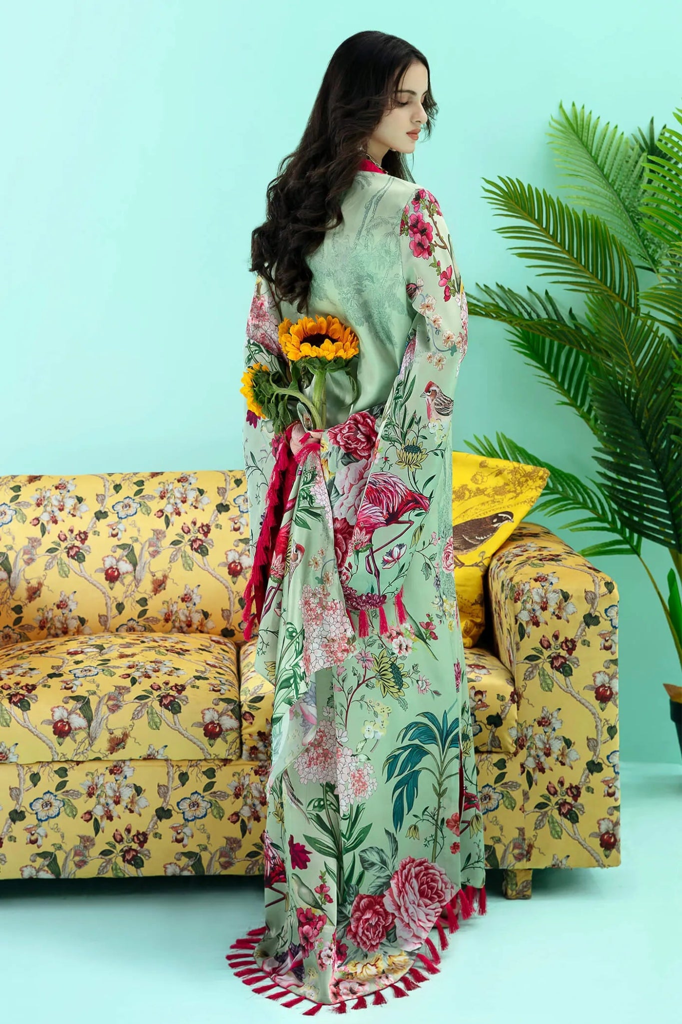 Model wearing a colorful fusion of mint FLAMINGO BLUSH dress from Musferah Saad's Resort collection '24, showcasing Pakistani clothes online in the UK.