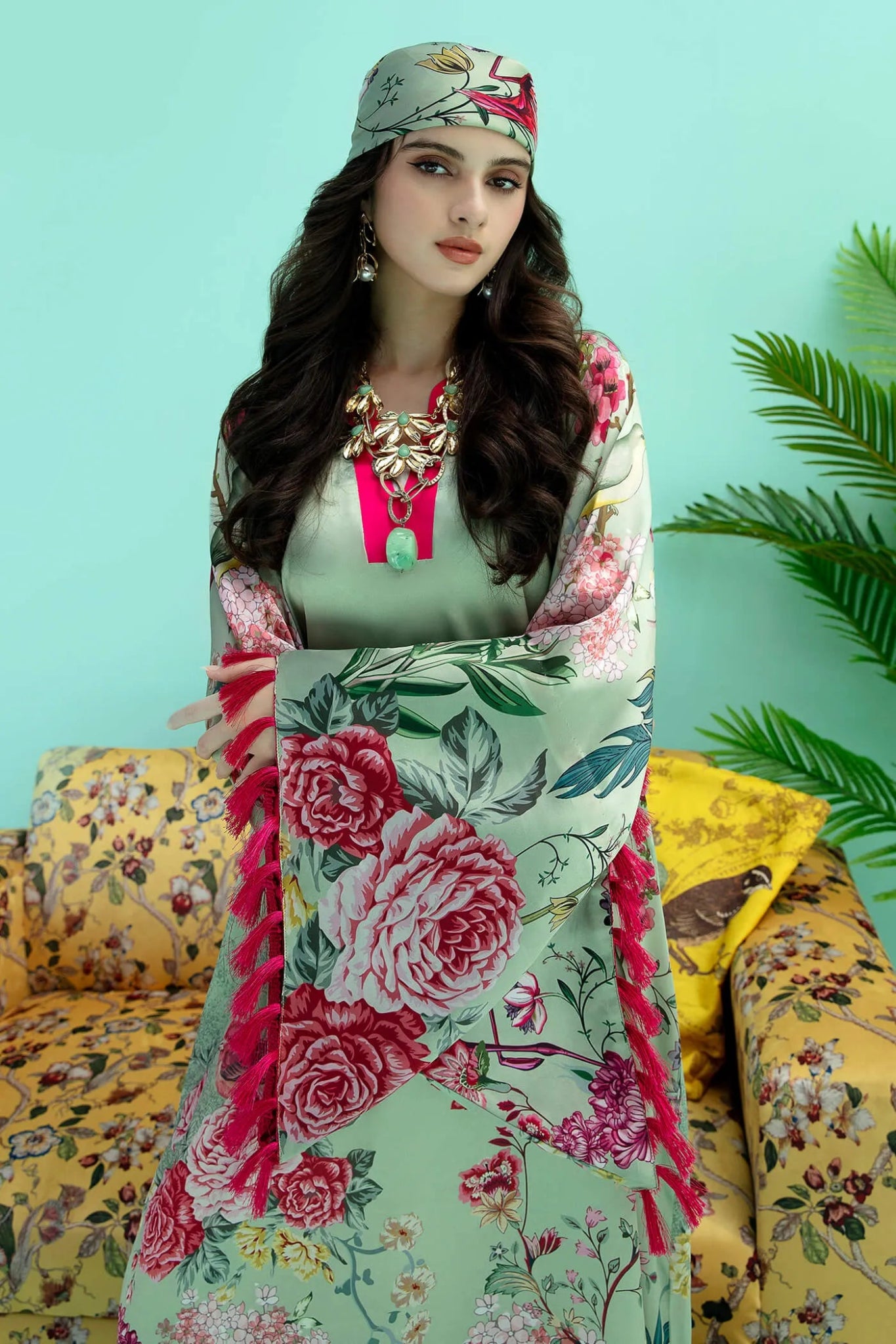 Model wearing a colorful fusion of mint FLAMINGO BLUSH dress from Musferah Saad's Resort collection '24, showcasing Pakistani clothes online in the UK.