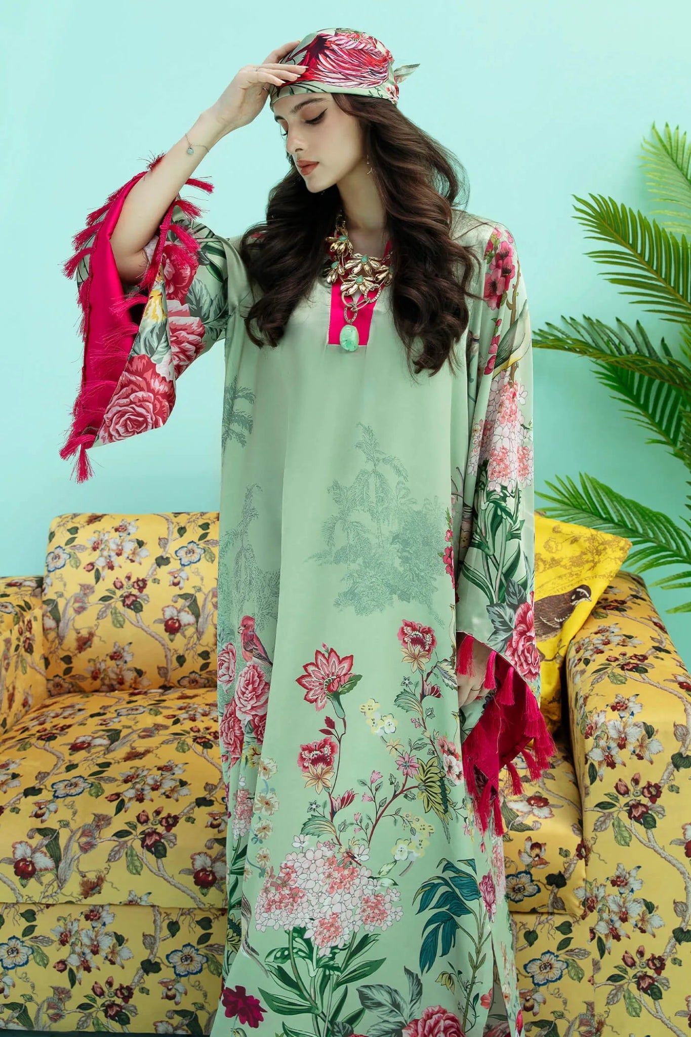 Model wearing a colorful fusion of mint FLAMINGO BLUSH dress from Musferah Saad's Resort collection '24, showcasing Pakistani clothes online in the UK.