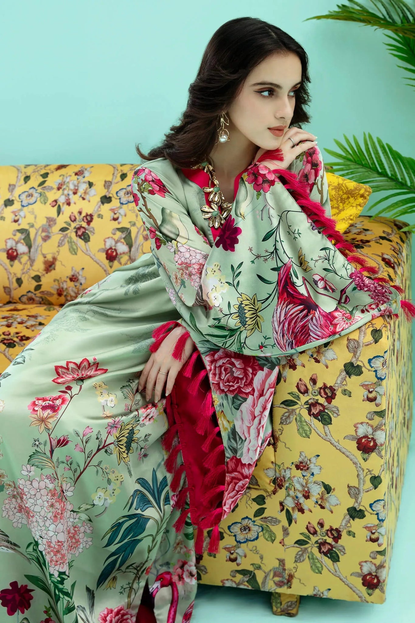 Model wearing a colorful fusion of mint FLAMINGO BLUSH dress from Musferah Saad's Resort collection '24, showcasing Pakistani clothes online in the UK.