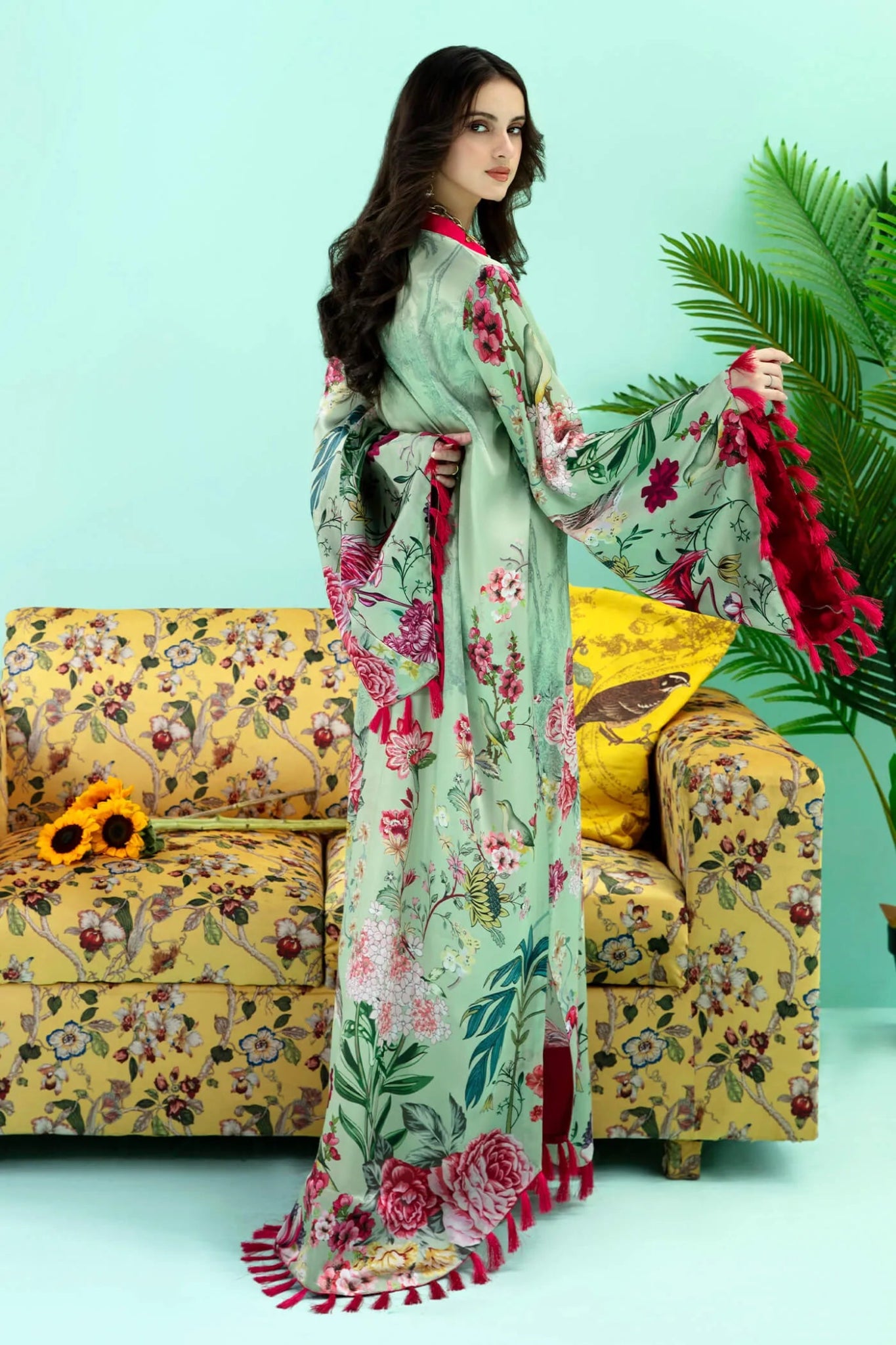 Model wearing a colorful fusion of mint FLAMINGO BLUSH dress from Musferah Saad's Resort collection '24, showcasing Pakistani clothes online in the UK.