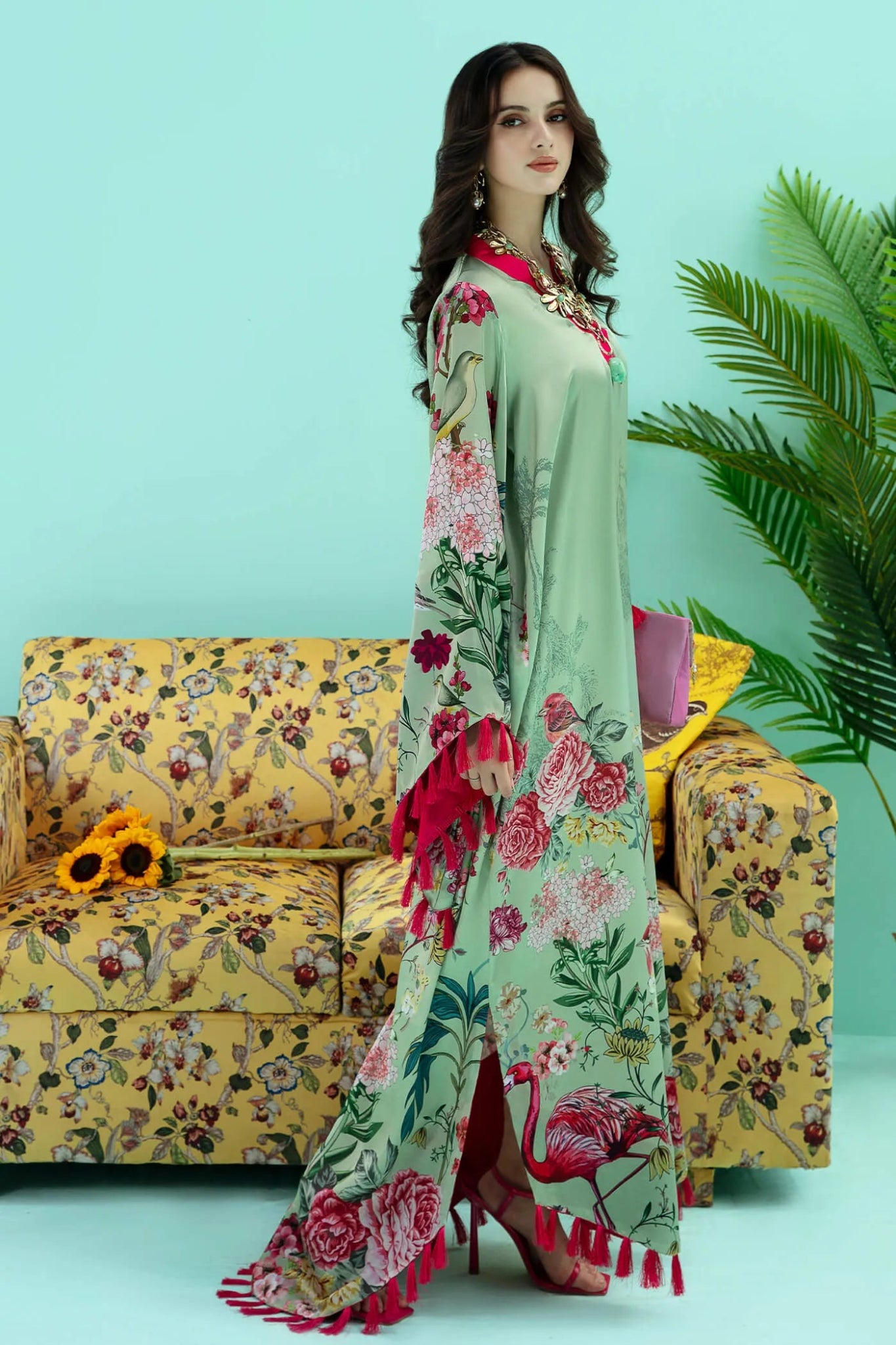 Model wearing a colorful fusion of mint FLAMINGO BLUSH dress from Musferah Saad's Resort collection '24, showcasing Pakistani clothes online in the UK.