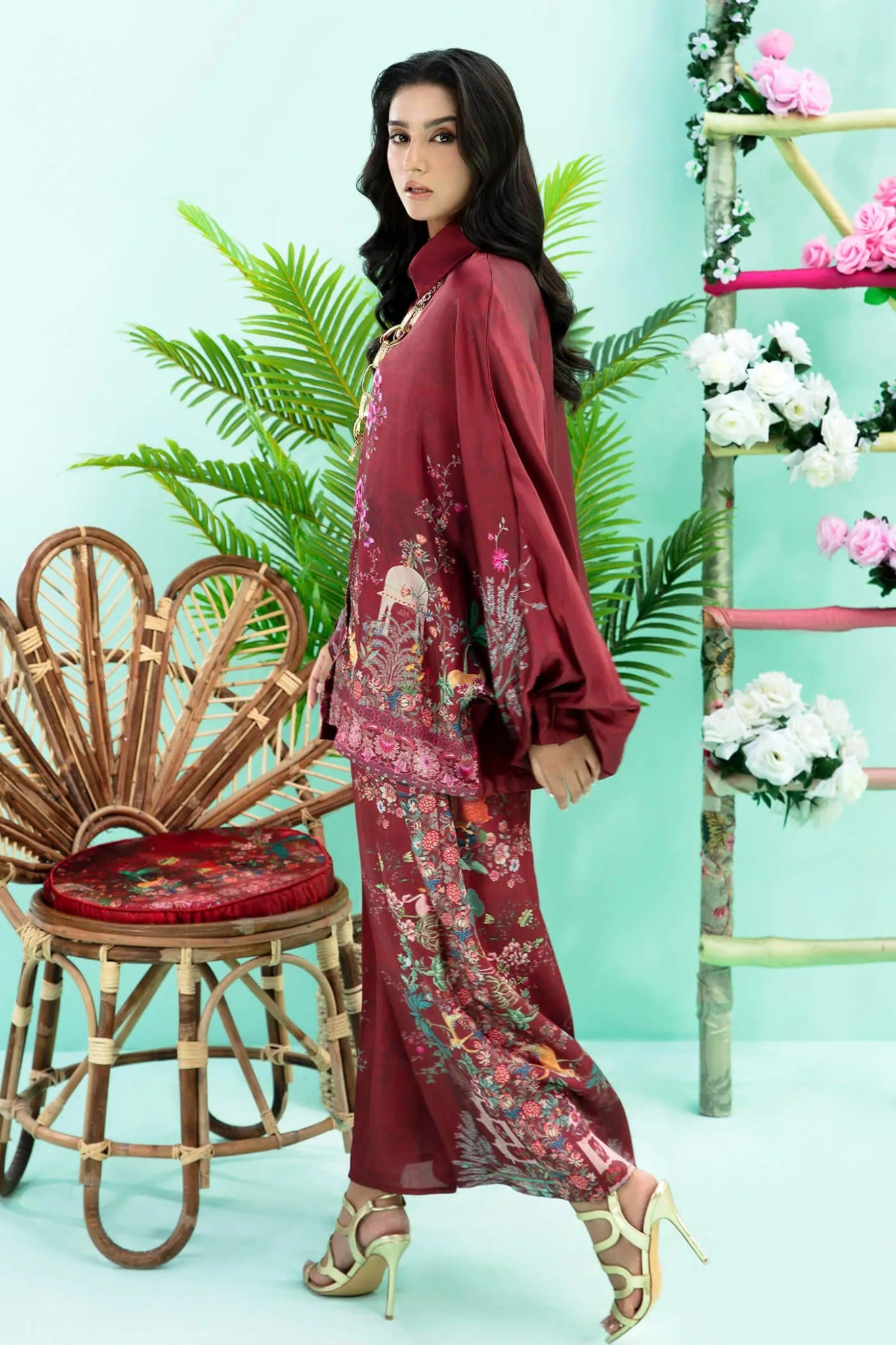 Model wearing maroon Floral Flare dress from Musferah Saad's Resort collection '24, showcasing Pakistani clothes online in the UK.