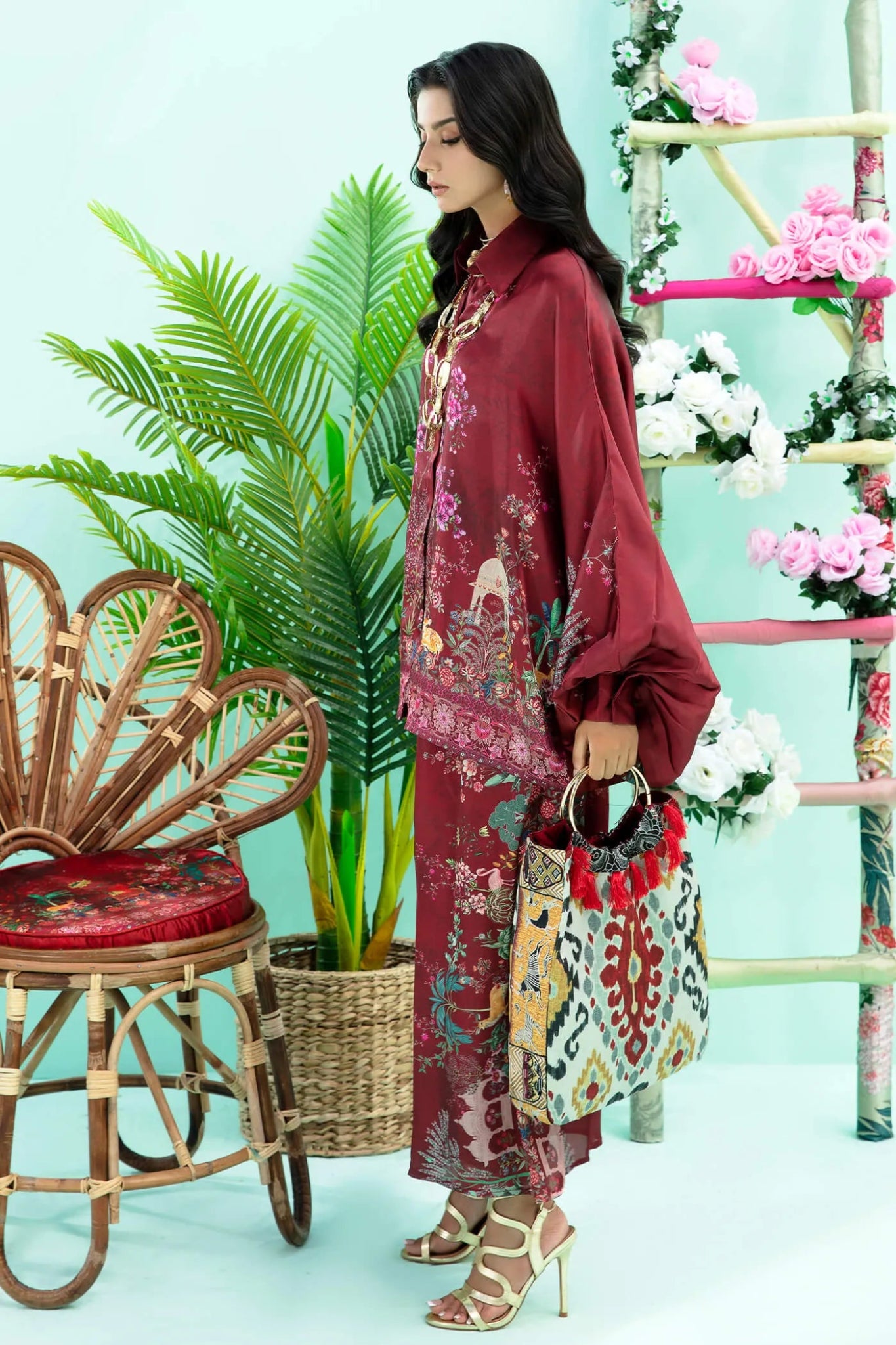 Model wearing maroon Floral Flare dress from Musferah Saad's Resort collection '24, showcasing Pakistani clothes online in the UK.