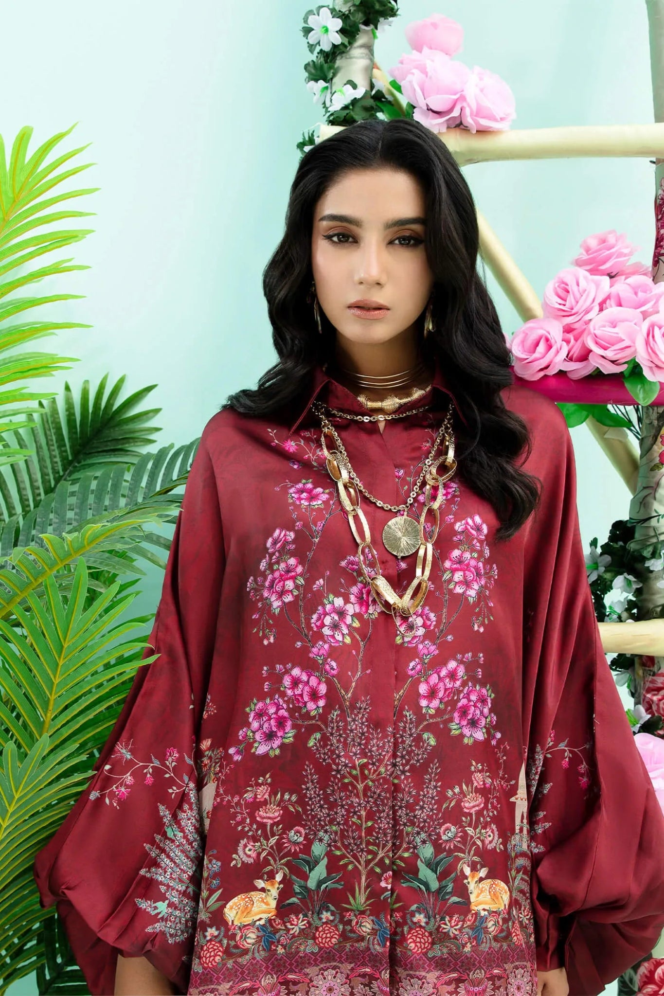 Model wearing maroon Floral Flare dress from Musferah Saad's Resort collection '24, showcasing Pakistani clothes online in the UK.