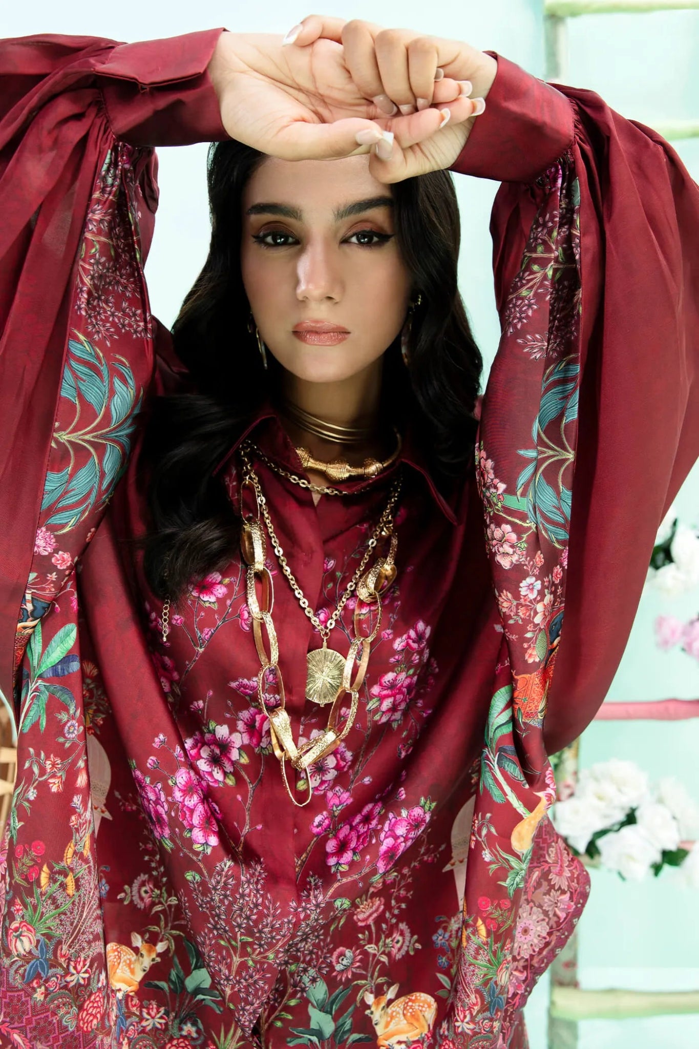Model wearing maroon Floral Flare dress from Musferah Saad's Resort collection '24, showcasing Pakistani clothes online in the UK.