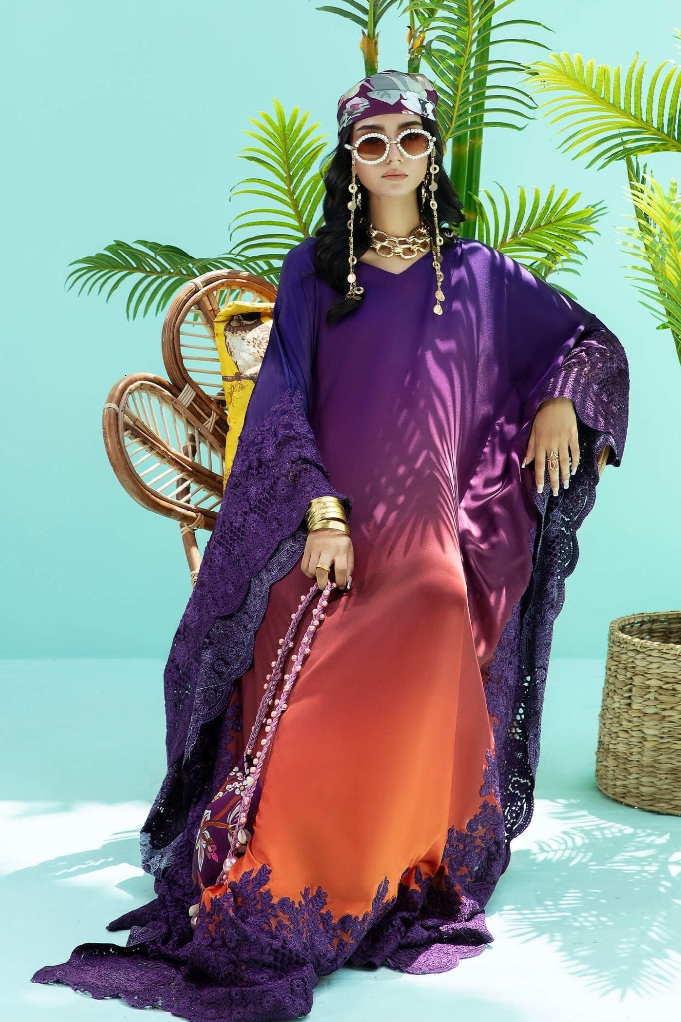 Model wearing purple and rust OMBRE ELEGANCE dress from Musferah Saad's Resort collection '24, showcasing Pakistani clothes online in the UK.