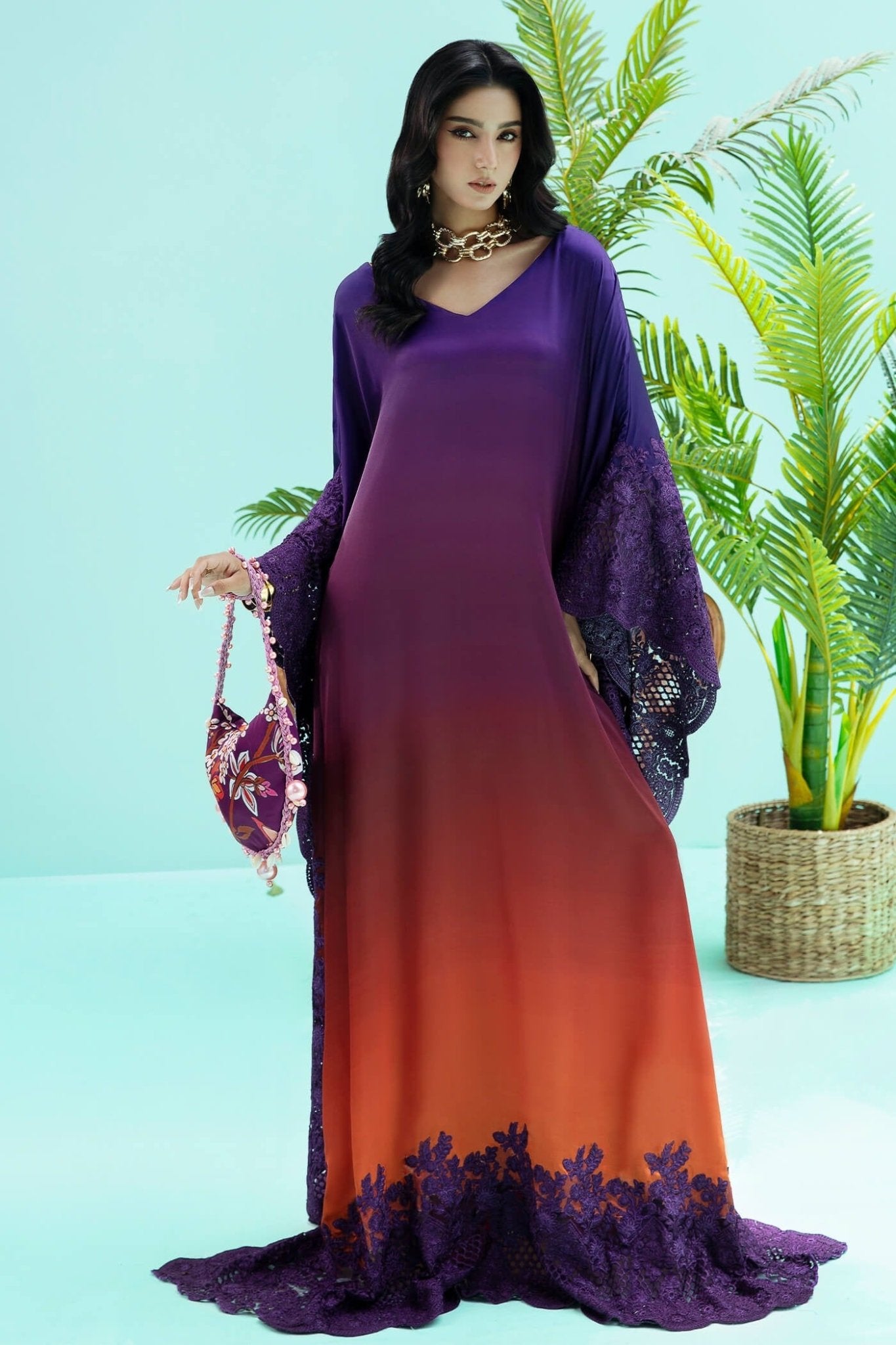 Model wearing purple and rust OMBRE ELEGANCE dress from Musferah Saad's Resort collection '24, showcasing Pakistani clothes online in the UK.