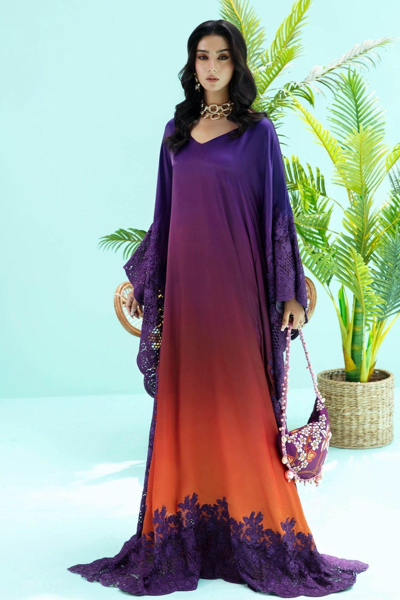 Model wearing purple and rust OMBRE ELEGANCE dress from Musferah Saad's Resort collection '24, showcasing Pakistani clothes online in the UK.