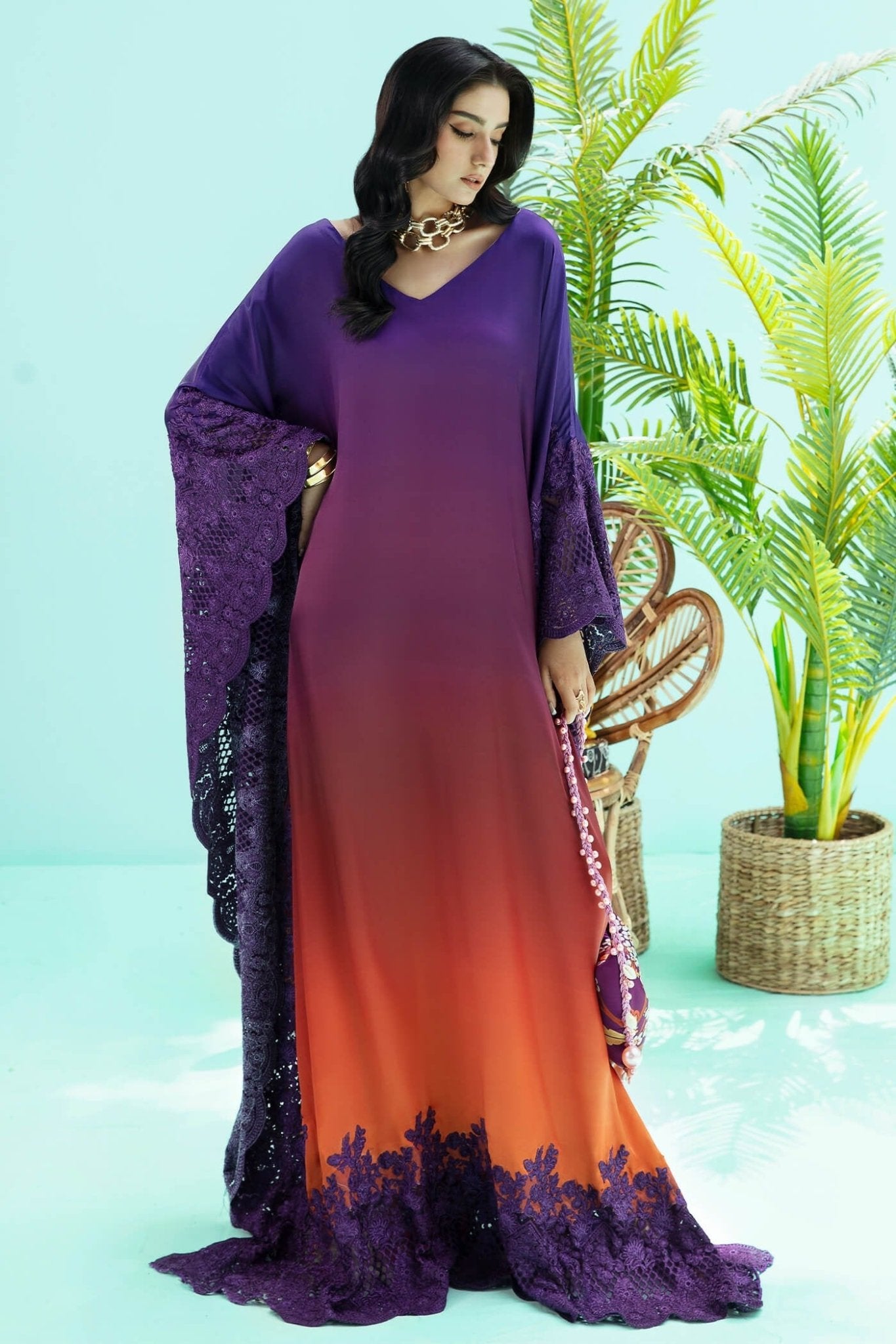 Model wearing purple and rust OMBRE ELEGANCE dress from Musferah Saad's Resort collection '24, showcasing Pakistani clothes online in the UK.