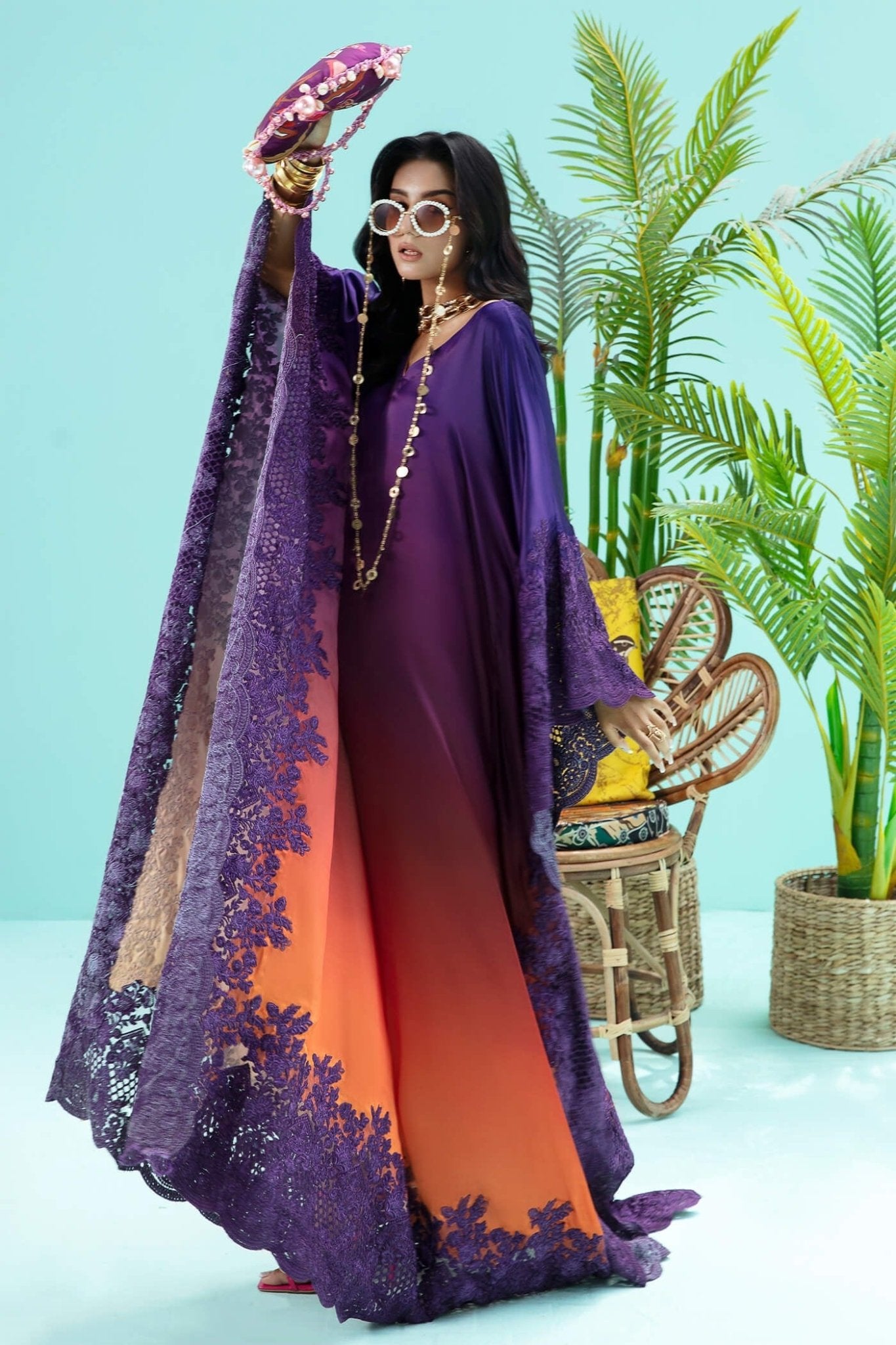 Model wearing purple and rust OMBRE ELEGANCE dress from Musferah Saad's Resort collection '24, showcasing Pakistani clothes online in the UK.