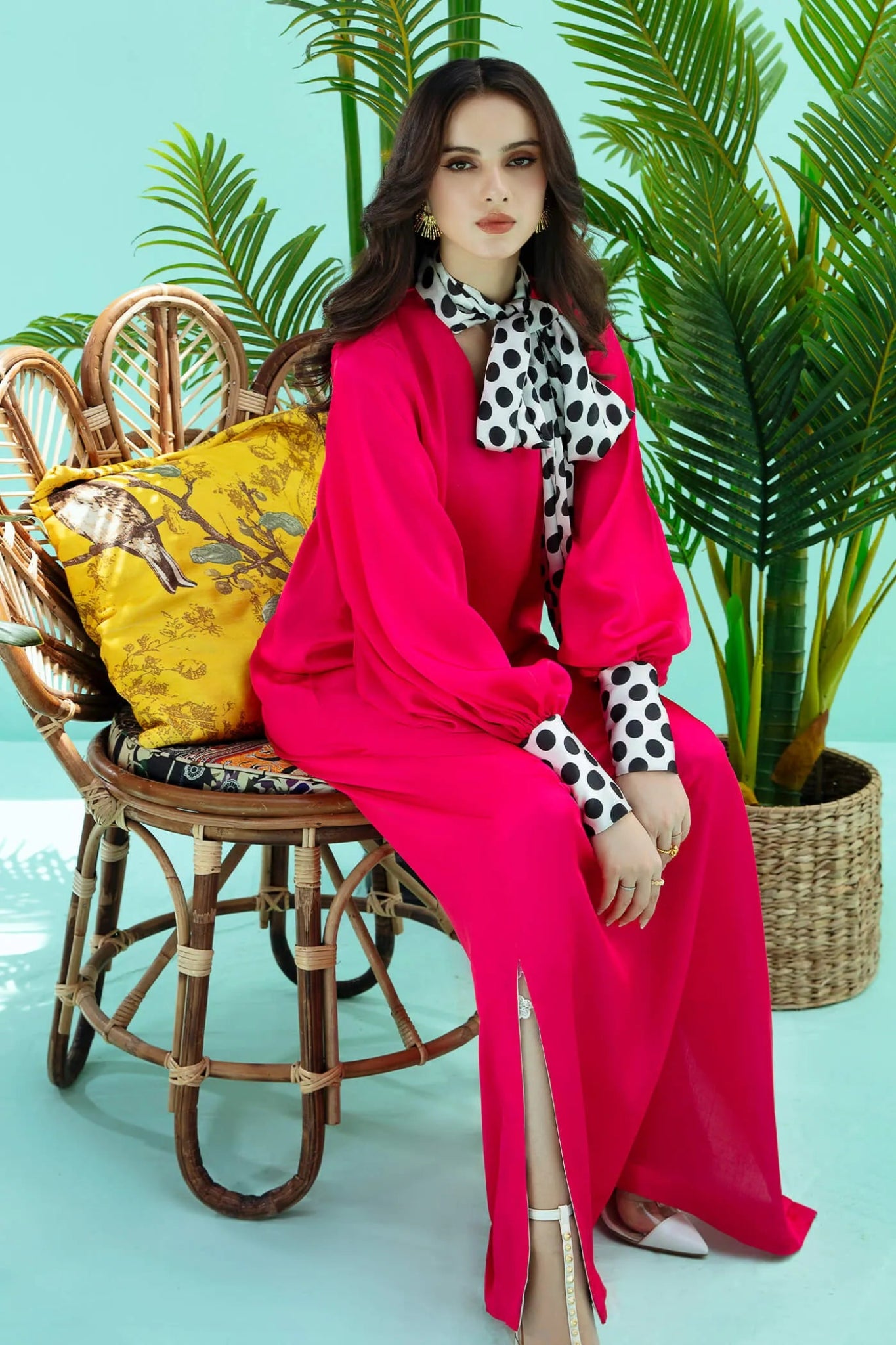 Model wearing fuchsia PIZZAZZ dress from Musferah Saad's Resort collection '24, showcasing Pakistani clothes online in the UK.