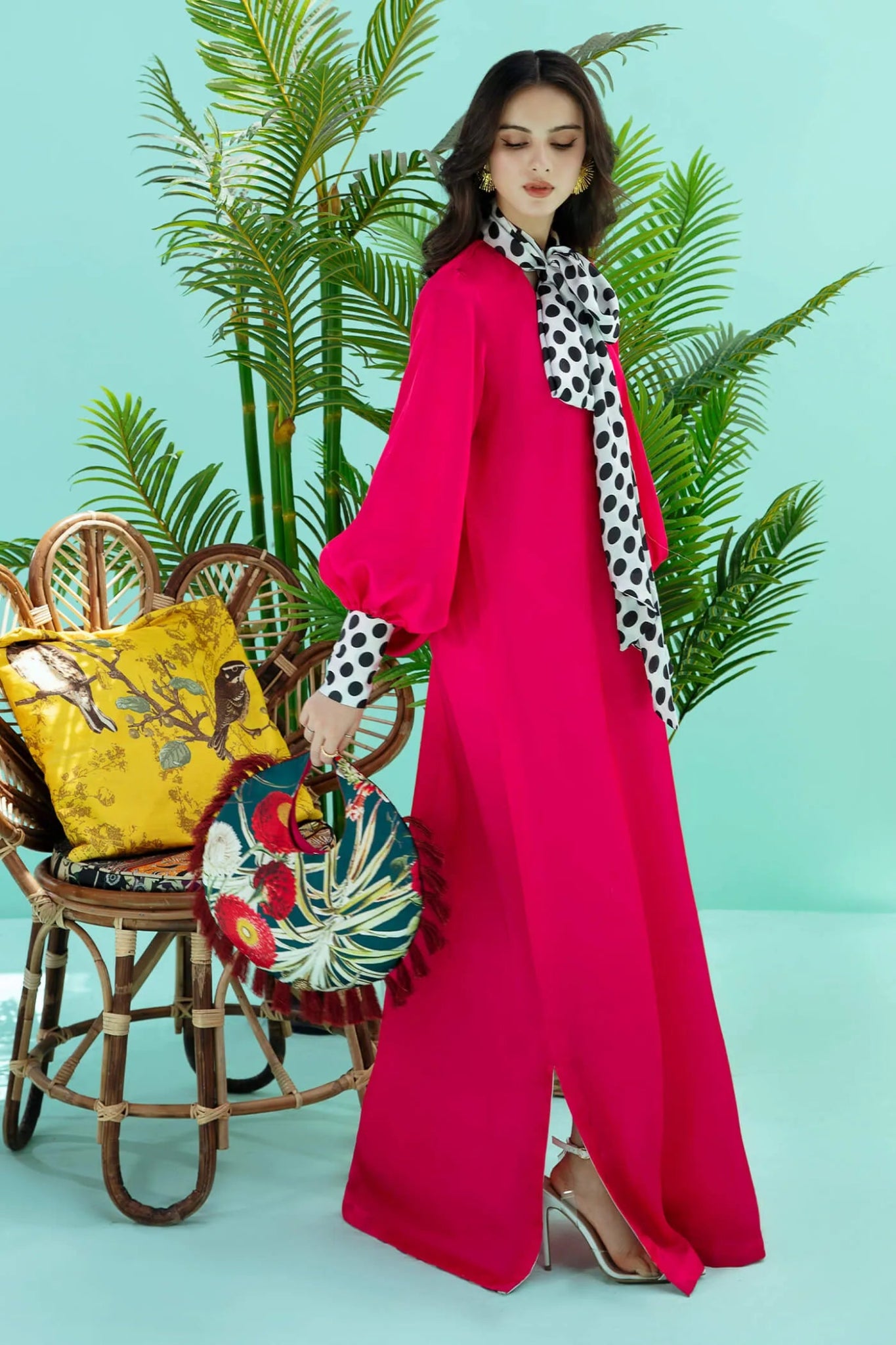 Model wearing fuchsia PIZZAZZ dress from Musferah Saad's Resort collection '24, showcasing Pakistani clothes online in the UK.