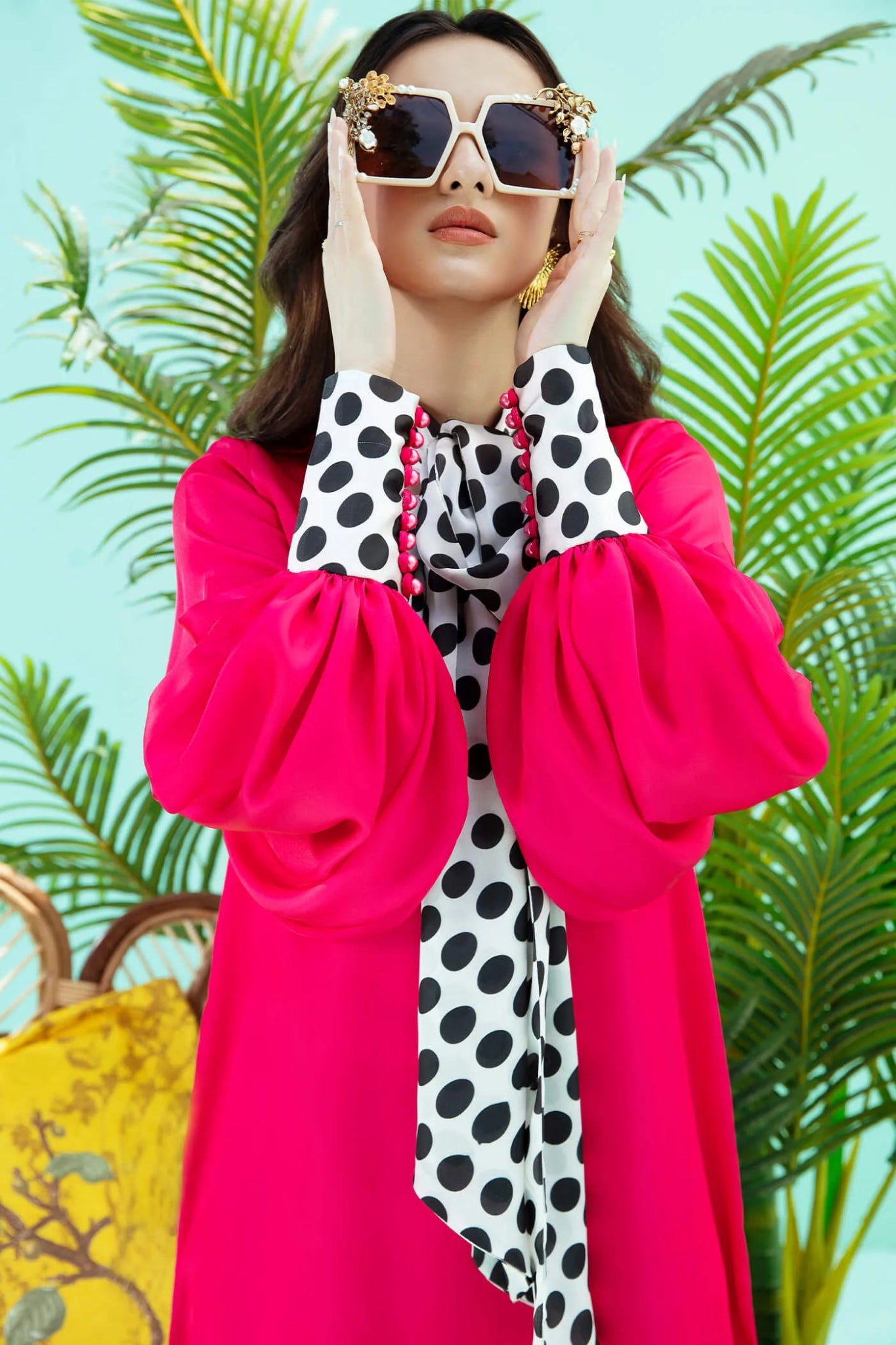 Model wearing fuchsia PIZZAZZ dress from Musferah Saad's Resort collection '24, showcasing Pakistani clothes online in the UK.
