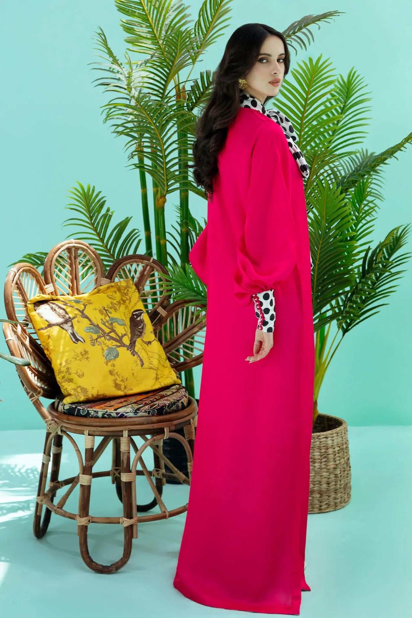 Model wearing fuchsia PIZZAZZ dress from Musferah Saad's Resort collection '24, showcasing Pakistani clothes online in the UK.