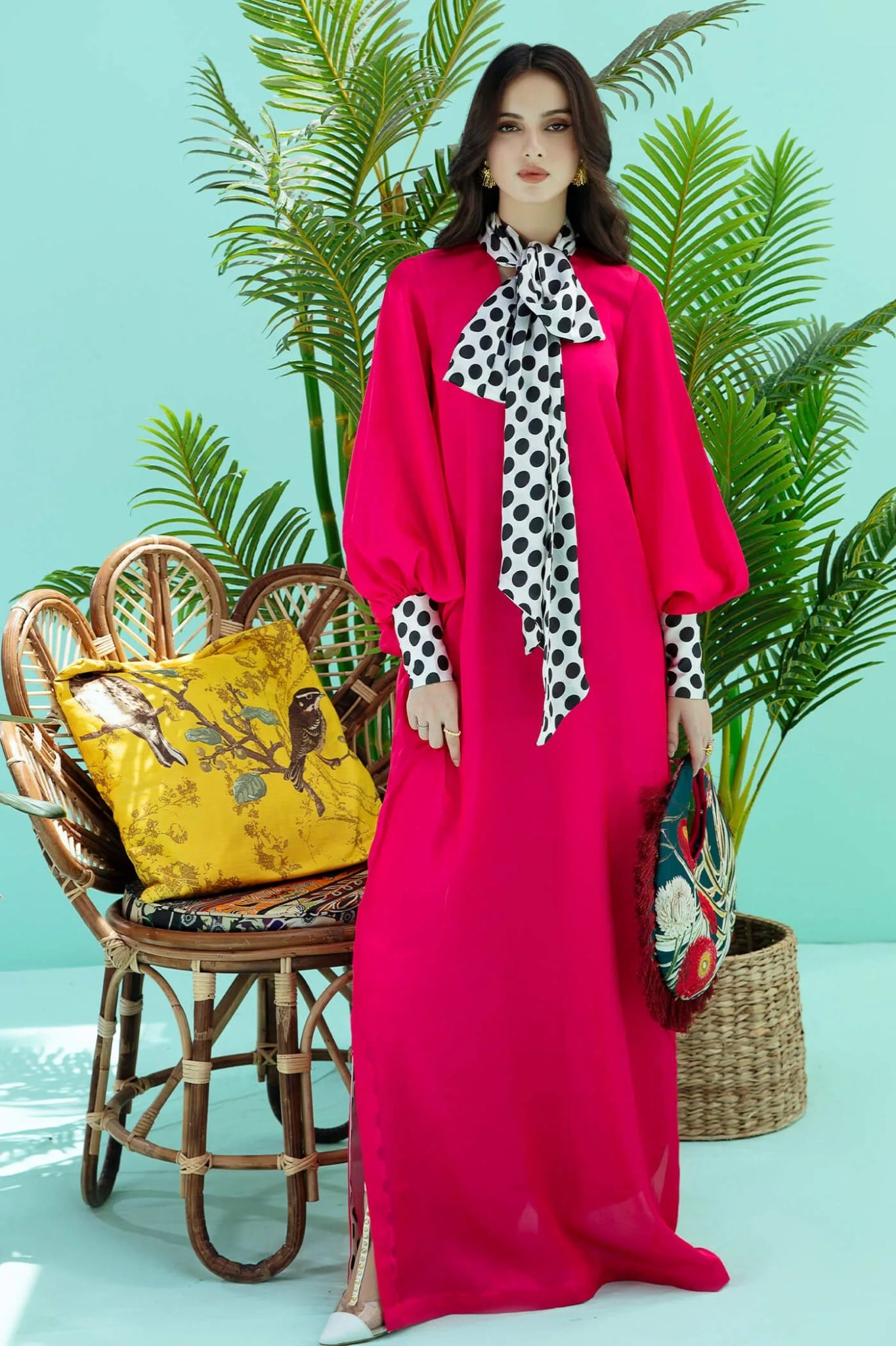 Model wearing fuchsia PIZZAZZ dress from Musferah Saad's Resort collection '24, showcasing Pakistani clothes online in the UK.