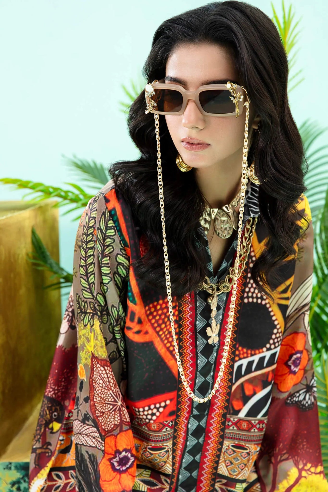 Model wearing colorful Wildflower dress from Musferah Saad's Resort collection '24, showcasing Pakistani clothes online in the UK.