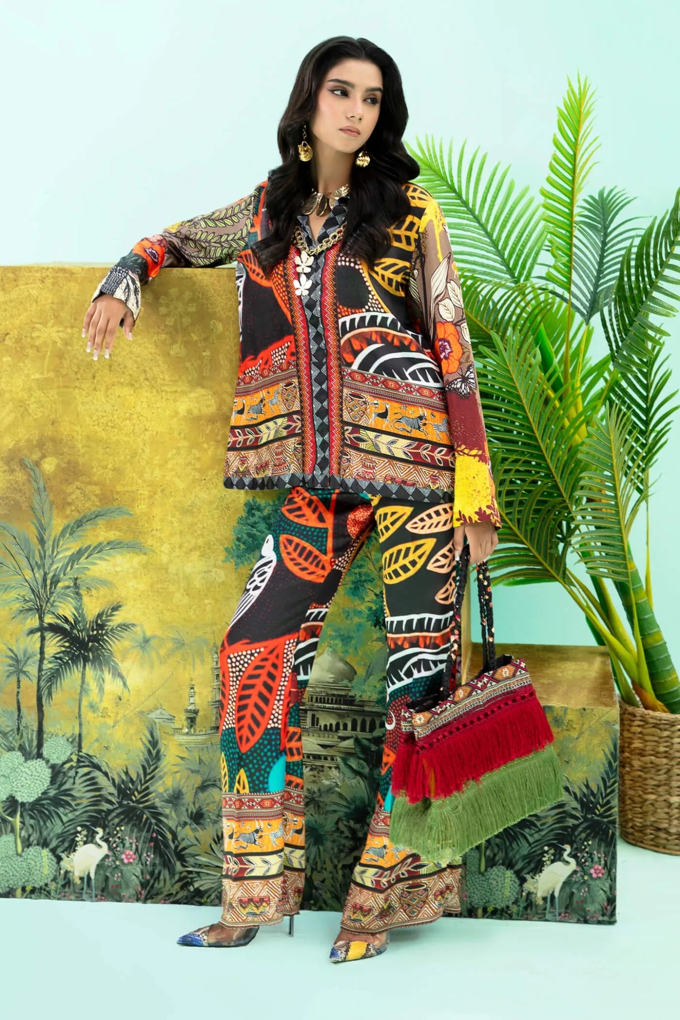 Model wearing colorful Wildflower dress from Musferah Saad's Resort collection '24, showcasing Pakistani clothes online in the UK.