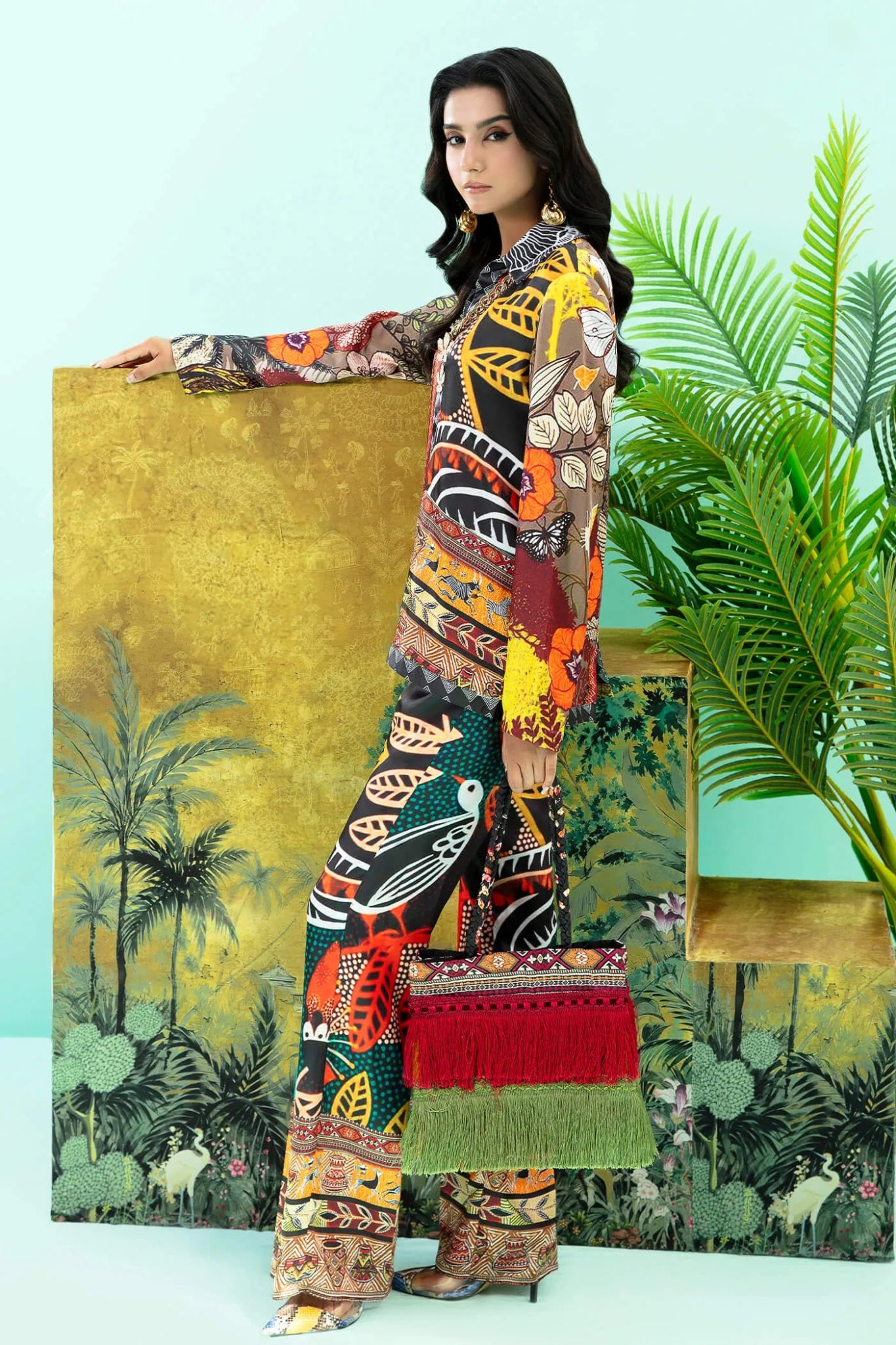 Model wearing colorful Wildflower dress from Musferah Saad's Resort collection '24, showcasing Pakistani clothes online in the UK.