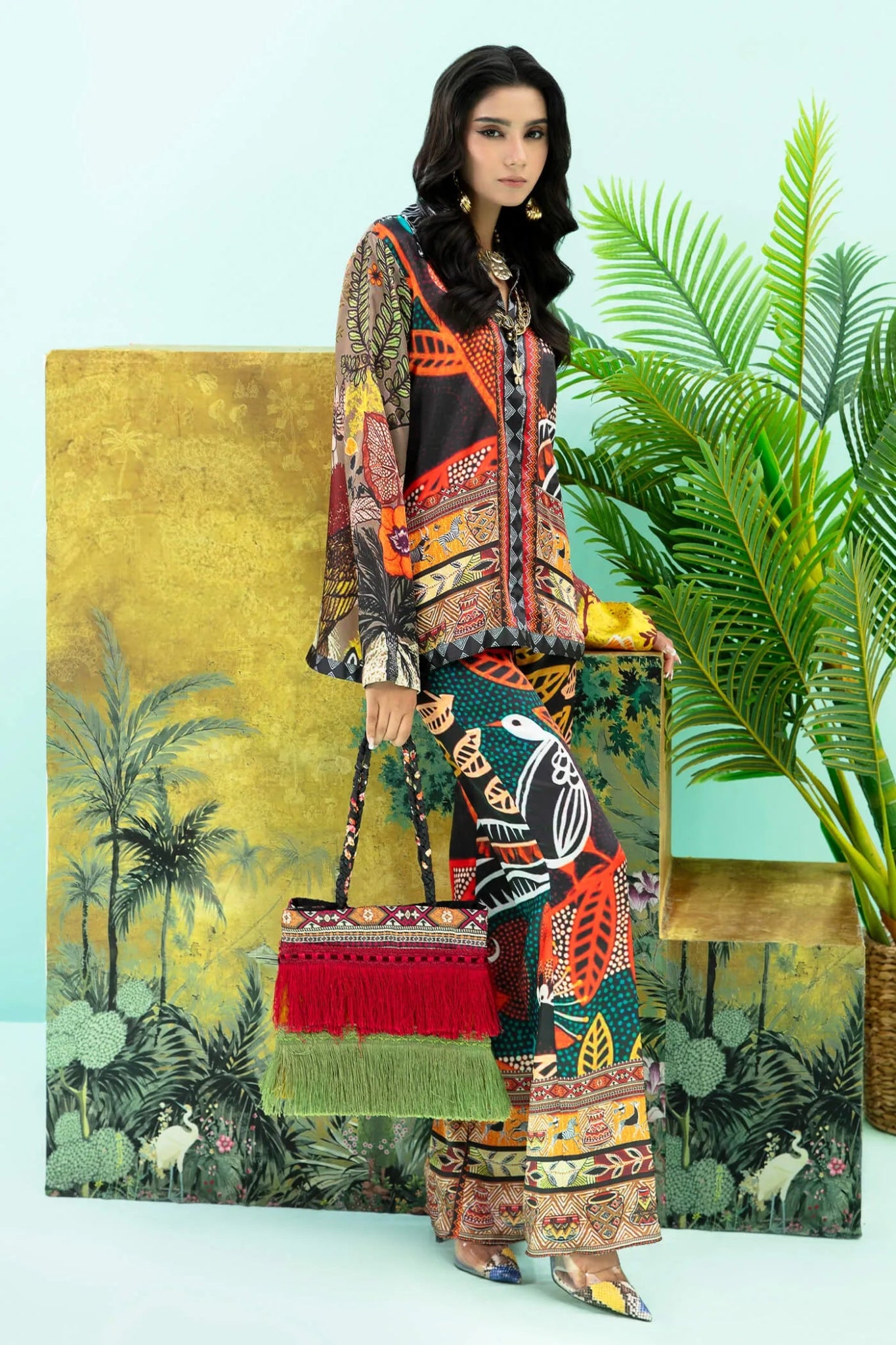 Model wearing colorful Wildflower dress from Musferah Saad's Resort collection '24, showcasing Pakistani clothes online in the UK.