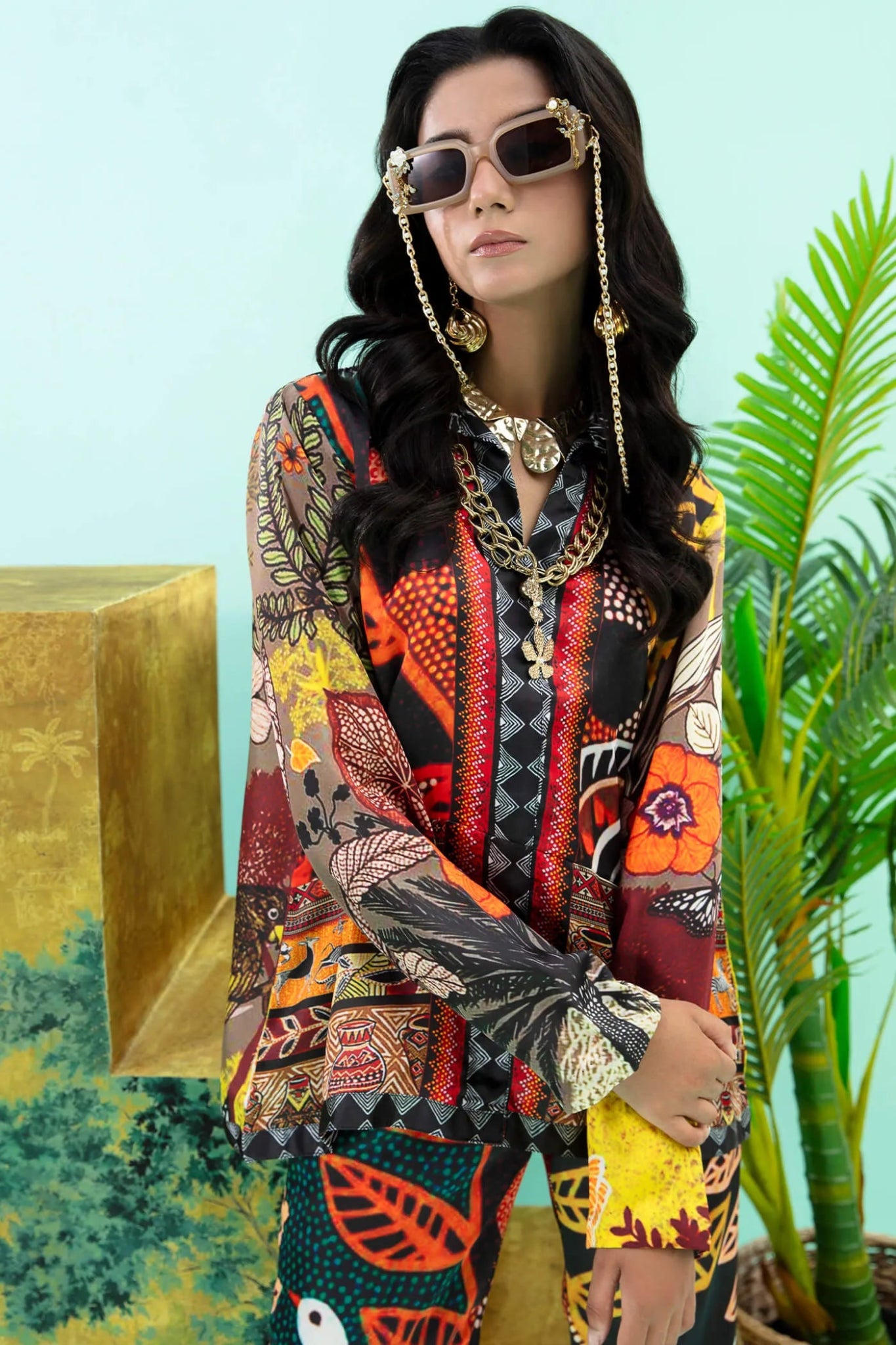 Model wearing colorful Wildflower dress from Musferah Saad's Resort collection '24, showcasing Pakistani clothes online in the UK.