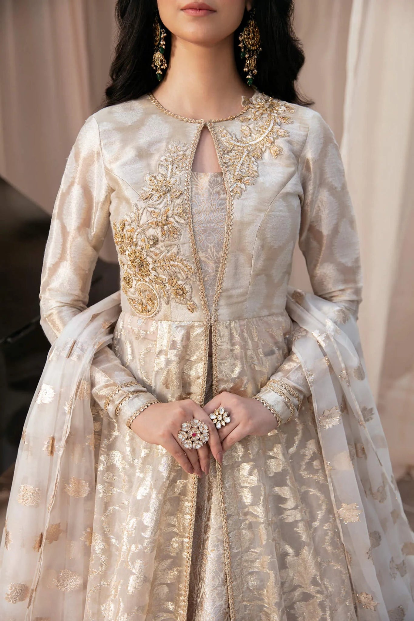 Model wearing a luxurious gold and ivory NOOR'S SYMPHONY dress from Musferah Saad's Symphony '23 collection, highlighting Pakistani clothes online in the UK.