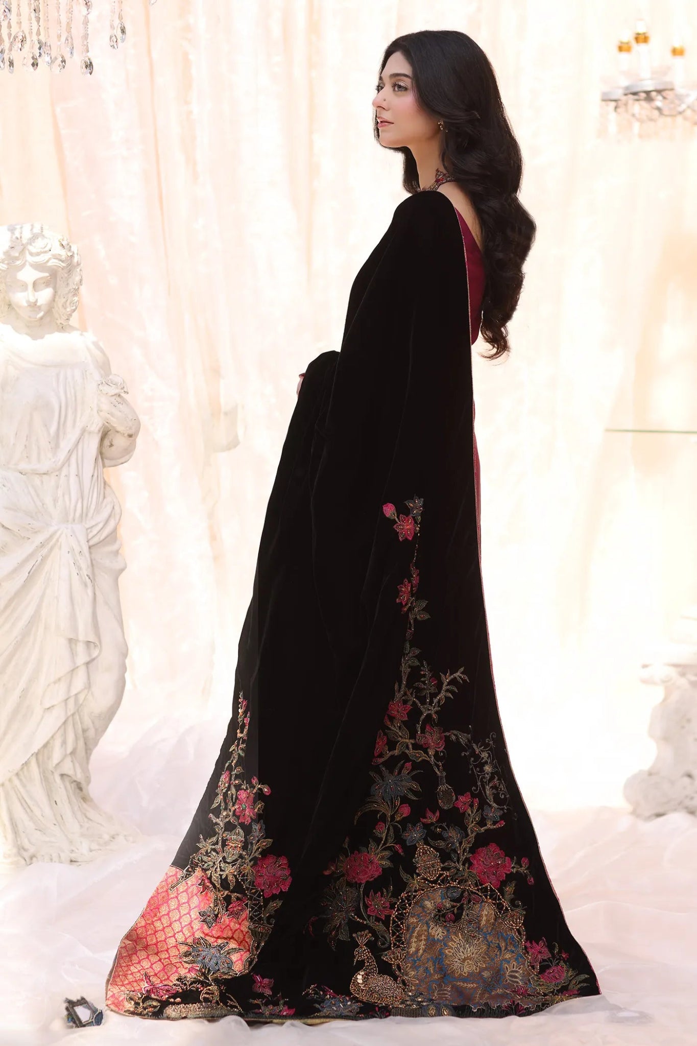 Model wearing Divine Fauna from Musferah Saad's The Serenade collection, featuring floral patterns. Pakistani clothes online in UK at Signature Labels.