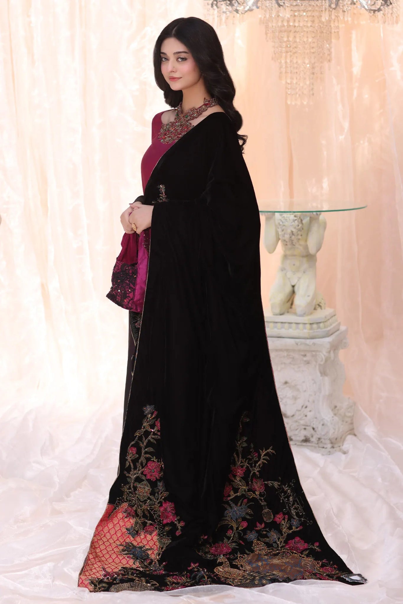 Model wearing Divine Fauna from Musferah Saad's The Serenade collection, featuring floral patterns. Pakistani clothes online in UK at Signature Labels.