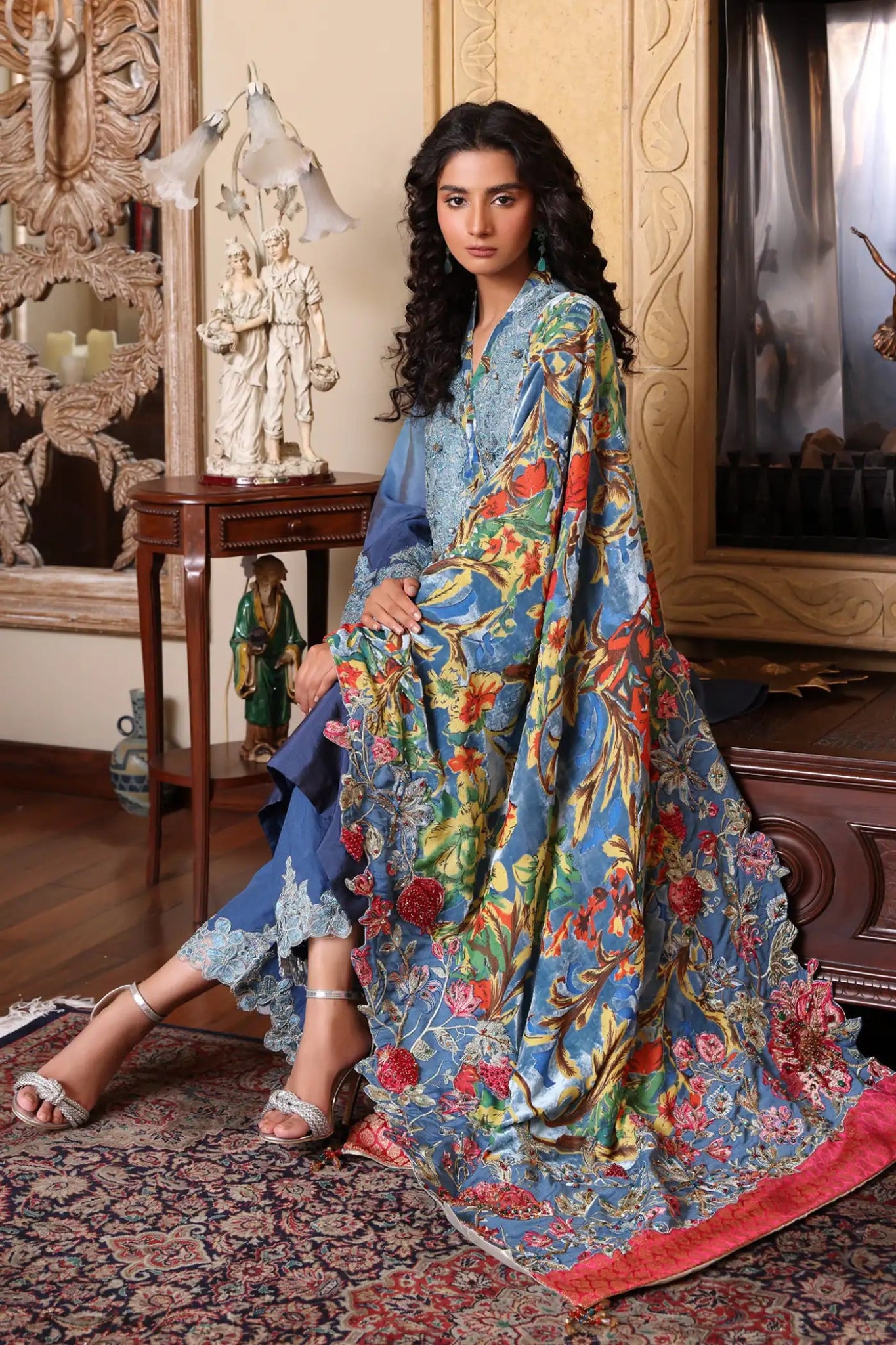 Model wearing Ruby Oasis from Musferah Saad's The Serenade collection in vibrant red, perfect for weddings. Pakistani clothes online in UK at Signature Labels.