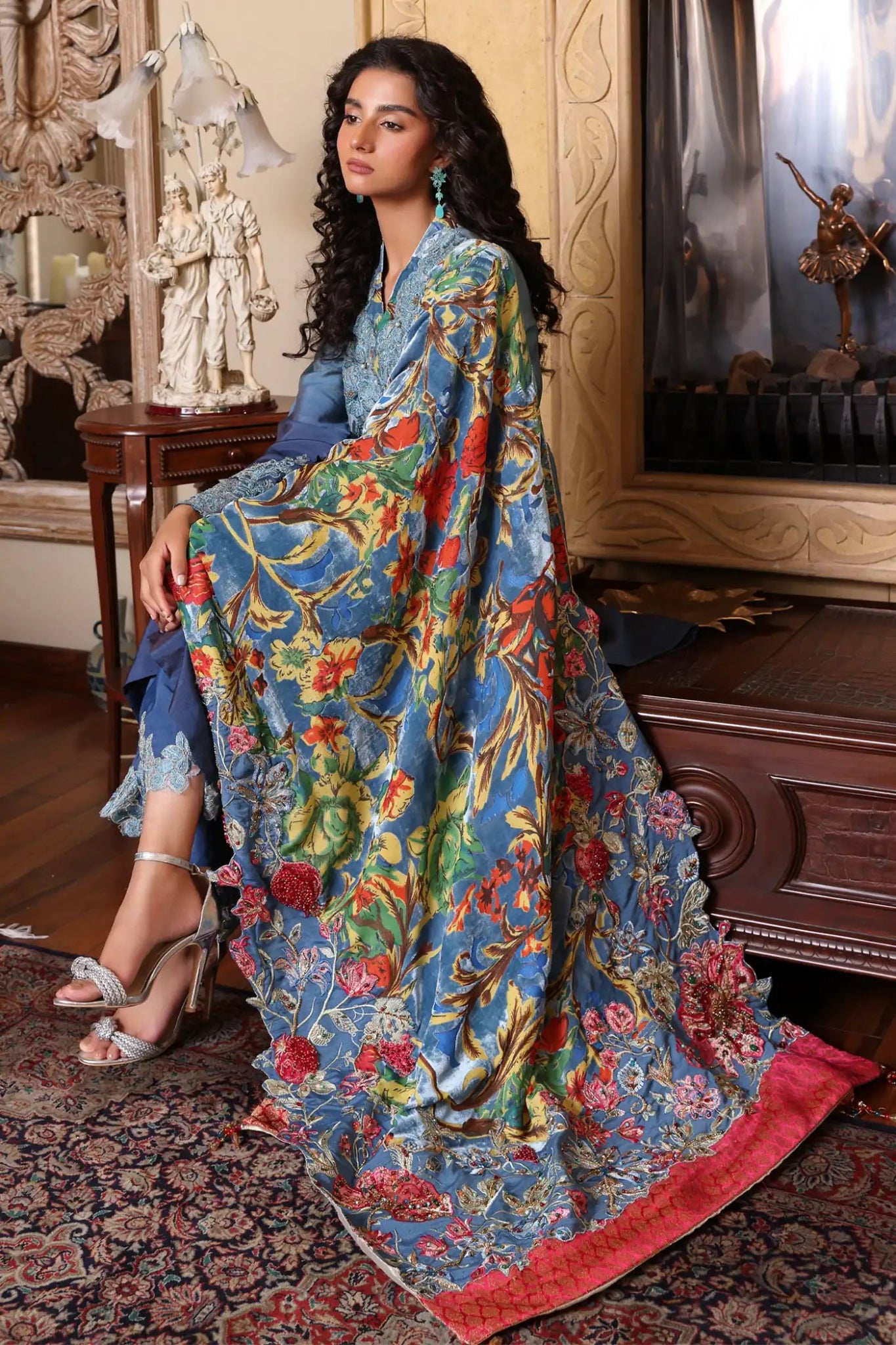 Model wearing Ruby Oasis from Musferah Saad's The Serenade collection in vibrant red, perfect for weddings. Pakistani clothes online in UK at Signature Labels.