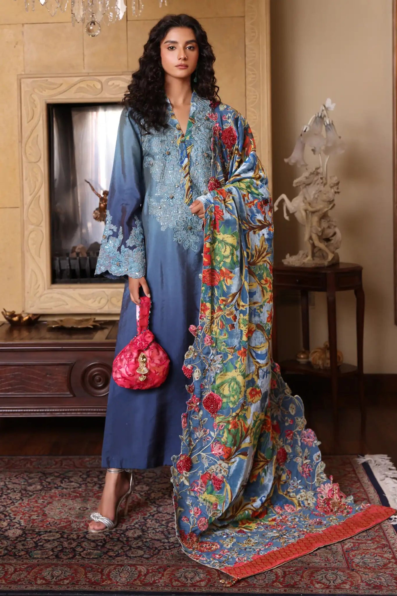 Model wearing Ruby Oasis from Musferah Saad's The Serenade collection in vibrant red, perfect for weddings. Pakistani clothes online in UK at Signature Labels.