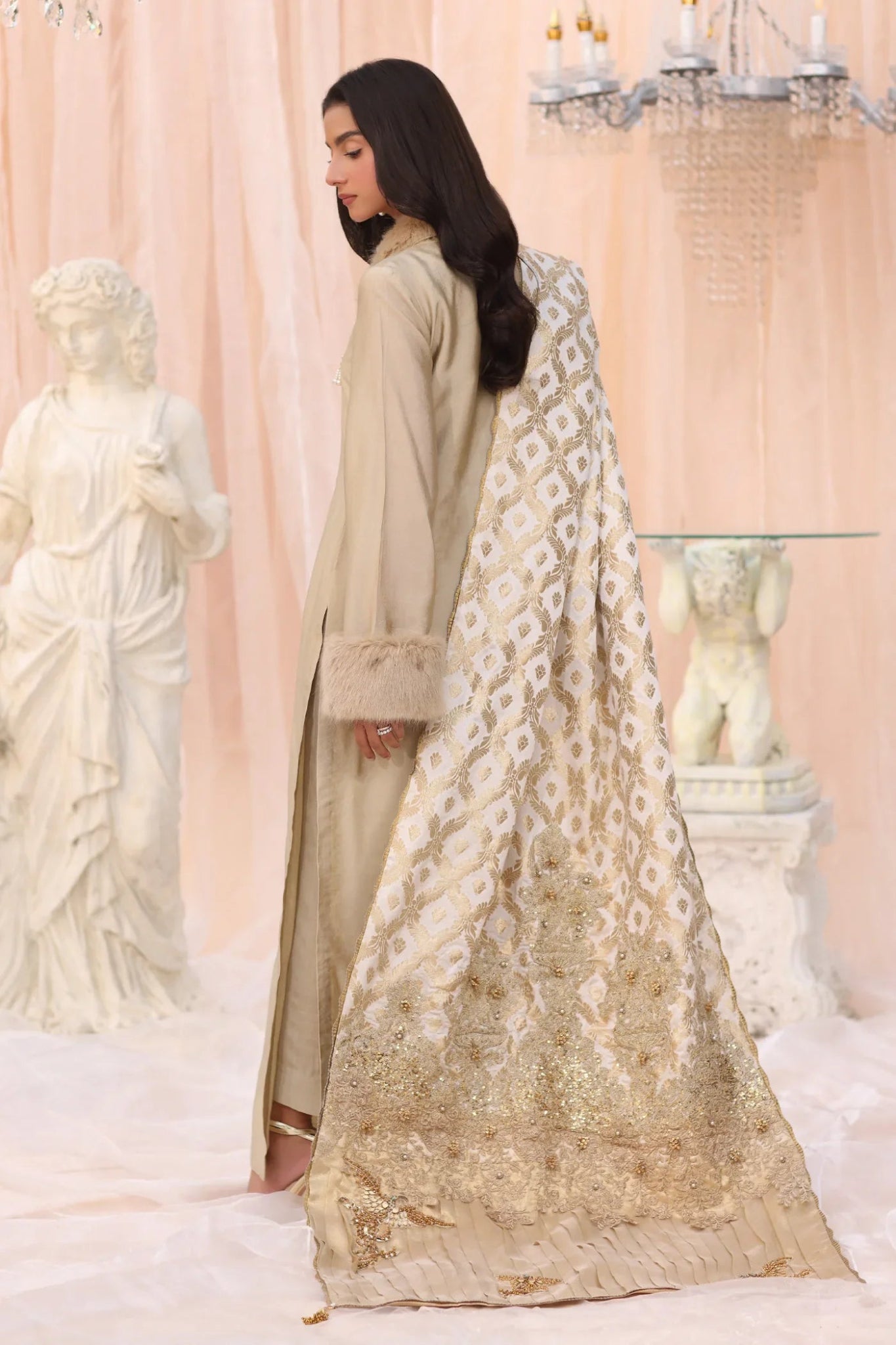 Model wearing The Duchess from Musferah Saad's The Serenade collection in elegant cream, perfect for weddings. Pakistani clothes online in UK at Signature Labels.