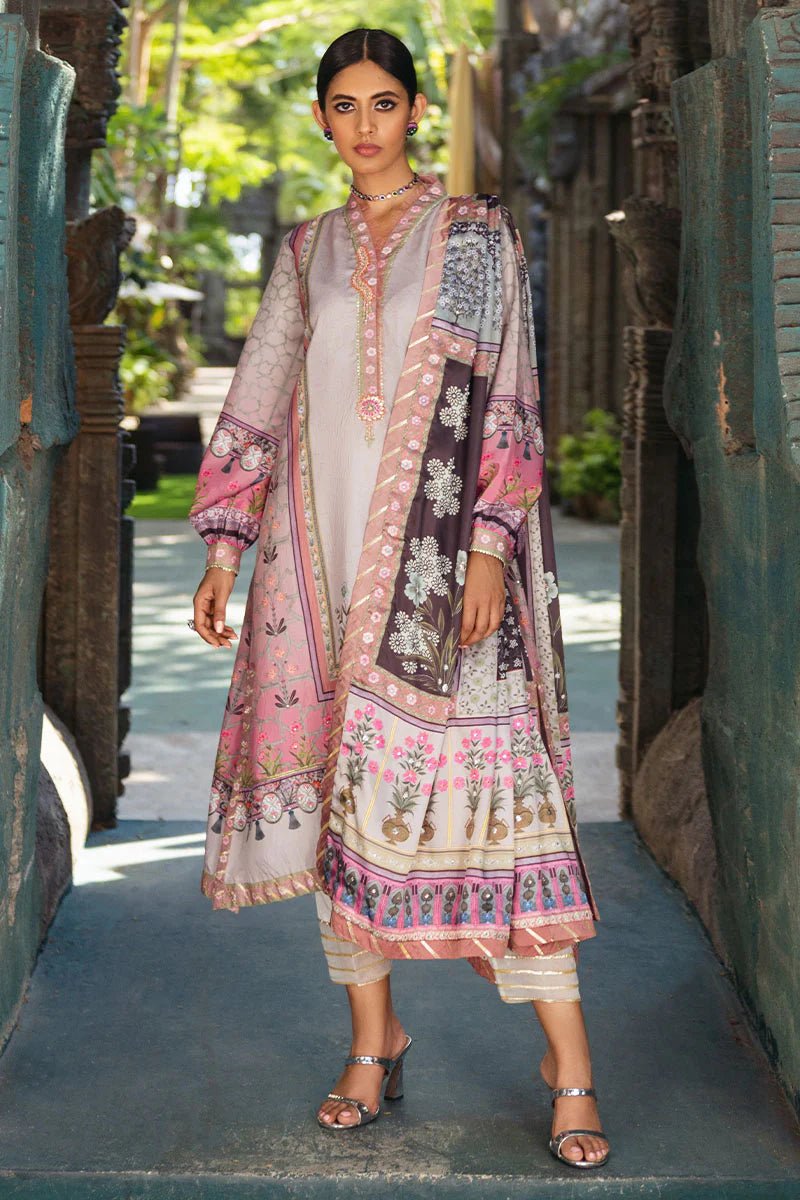 Model wearing Pewter dress from Mushq's Nirvana Silk Edit, featuring intricate floral prints in shades of pewter, pink, and grey. Pakistani winter casual pret clothes available online in the UK.
