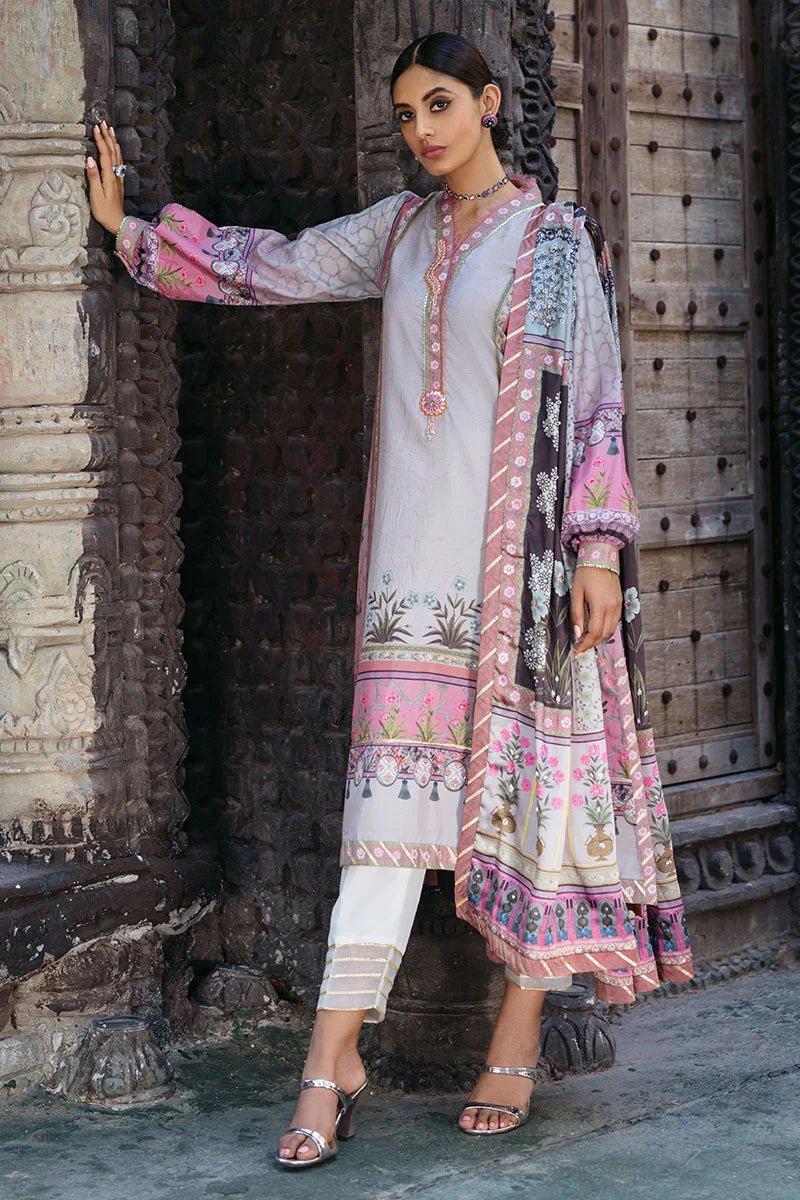 Model wearing Pewter dress from Mushq's Nirvana Silk Edit, featuring intricate floral prints in shades of pewter, pink, and grey. Pakistani winter casual pret clothes available online in the UK.