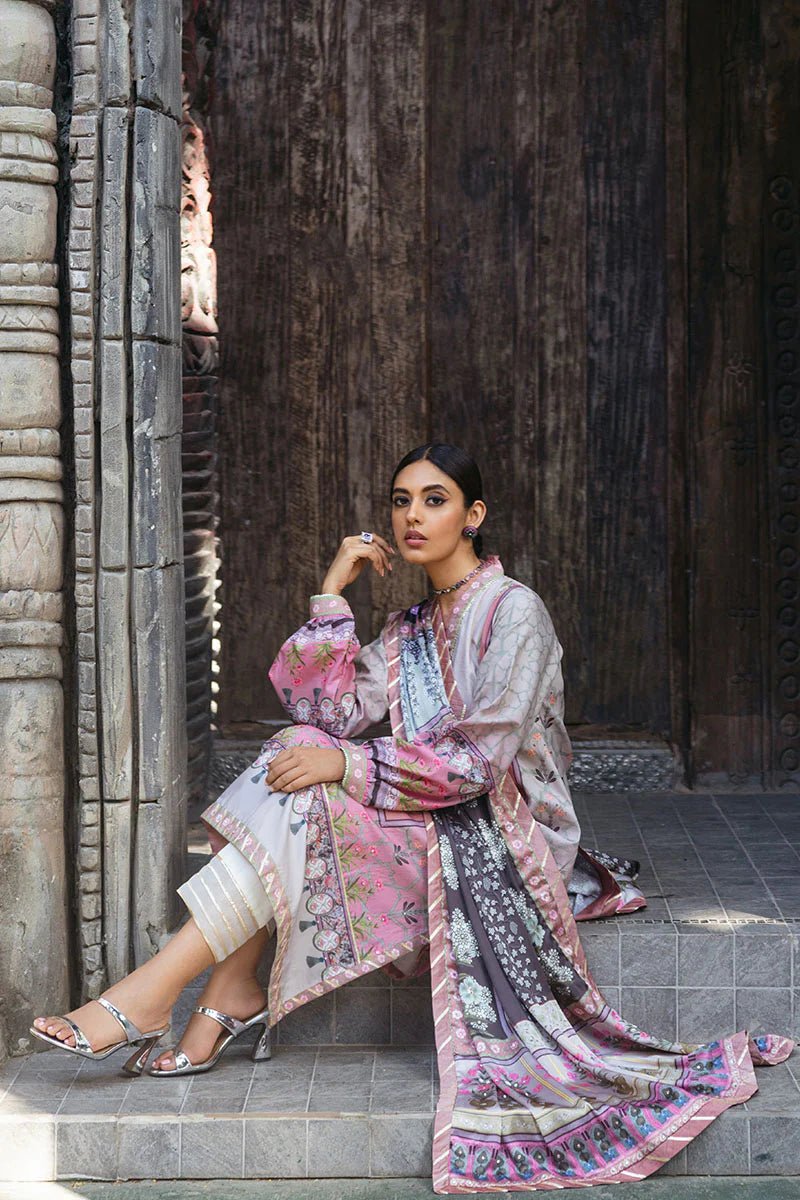 Model wearing Pewter dress from Mushq's Nirvana Silk Edit, featuring intricate floral prints in shades of pewter, pink, and grey. Pakistani winter casual pret clothes available online in the UK.