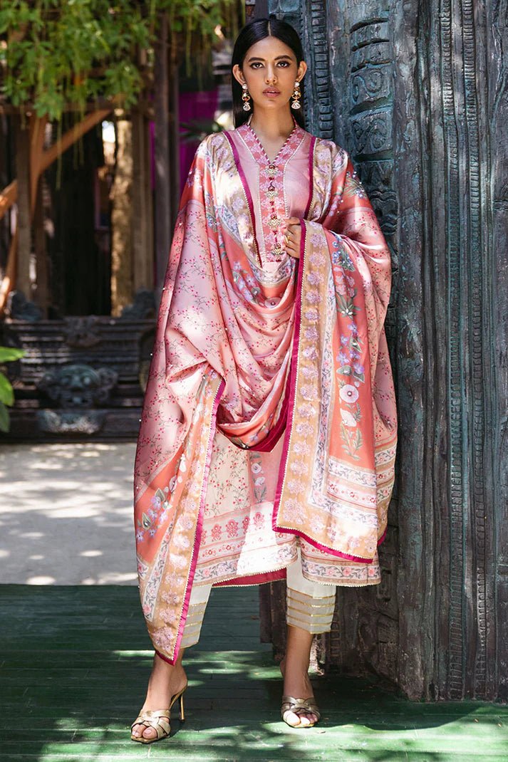 Model wearing Roseate dress from Mushq's Nirvana Silk Edit in soft pink with intricate floral designs. Pakistani winter casual pret clothes available online in the UK.