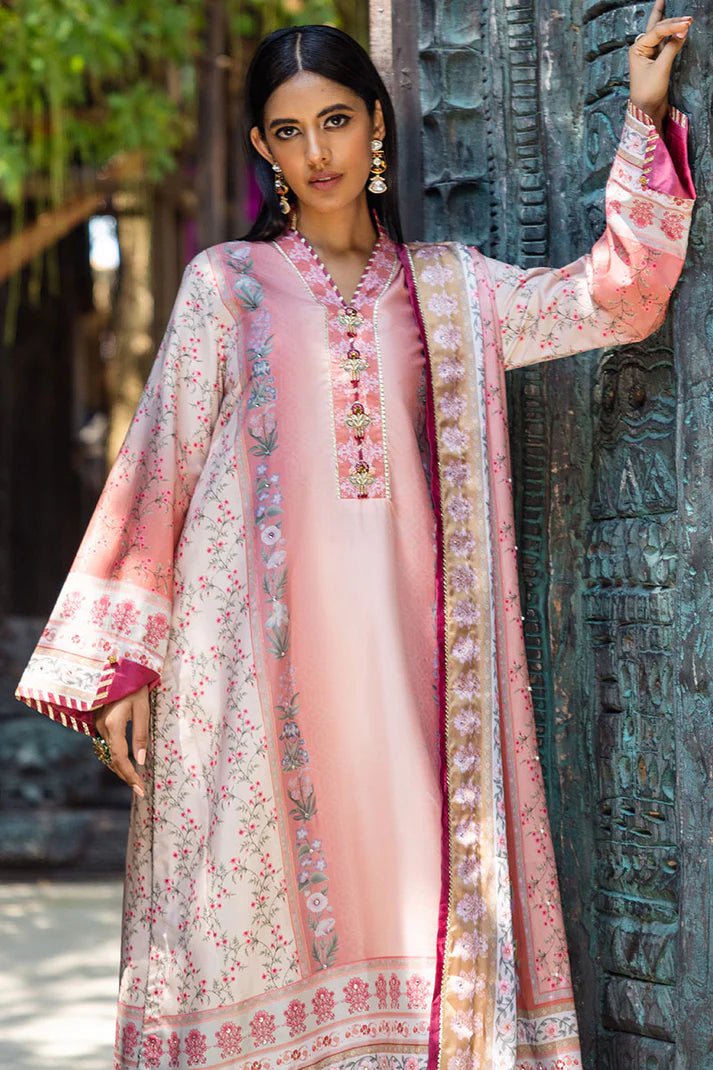 Model wearing Roseate dress from Mushq's Nirvana Silk Edit in soft pink with intricate floral designs. Pakistani winter casual pret clothes available online in the UK.