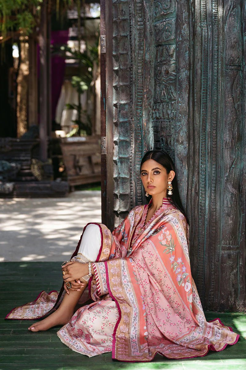 Model wearing Roseate dress from Mushq's Nirvana Silk Edit in soft pink with intricate floral designs. Pakistani winter casual pret clothes available online in the UK.