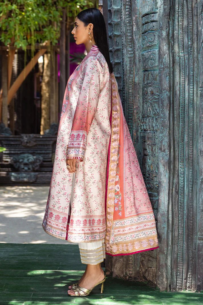 Model wearing Roseate dress from Mushq's Nirvana Silk Edit in soft pink with intricate floral designs. Pakistani winter casual pret clothes available online in the UK.