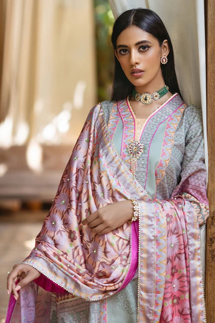 Model wearing Taffy dress from Mushq's Nirvana Silk Edit in pastel tones with intricate pink and grey patterns. Pakistani winter casual pret clothes available online in the UK.