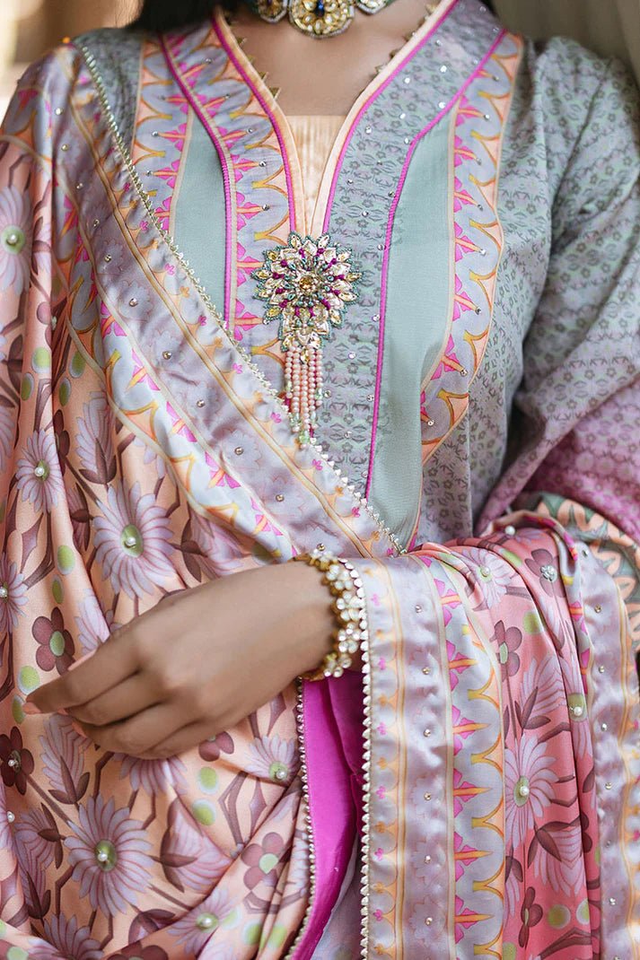 Model wearing Taffy dress from Mushq's Nirvana Silk Edit in pastel tones with intricate pink and grey patterns. Pakistani winter casual pret clothes available online in the UK.